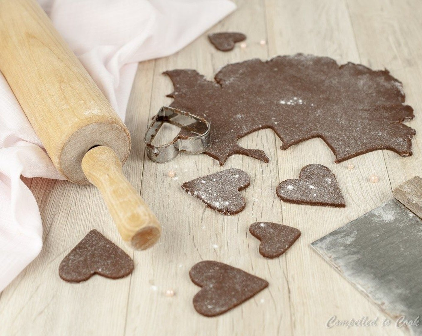 step 9 Remove dough from fridge and allow to rest at room temperature for about 10 minutes. Dust a work surface with flour and roll dough out to 1/8-inch thickness. Cut into desired shapes and place 1-inch apart on baking trays.
