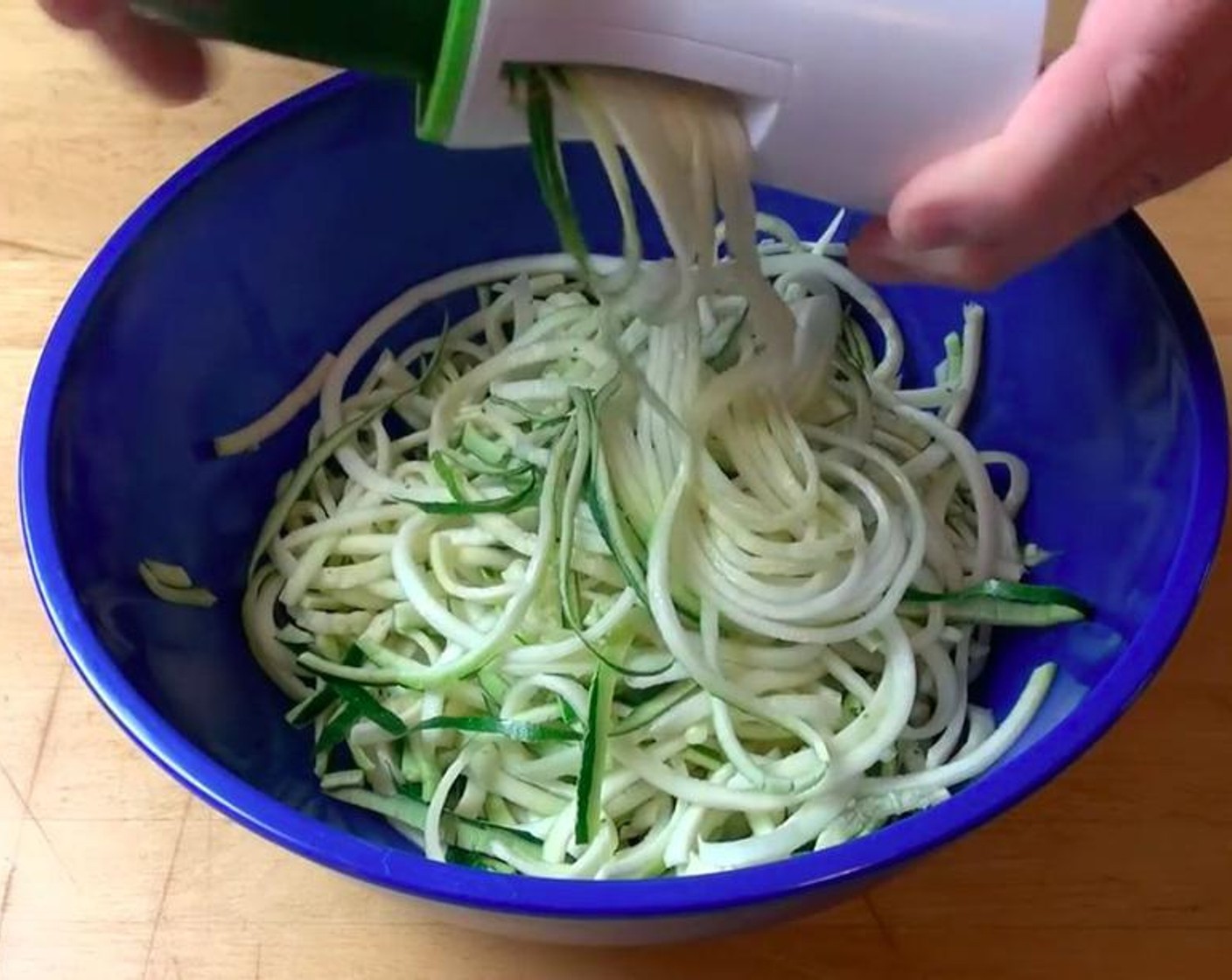 step 1 Use a spiralizer to spiralize the Carrots (3) and the Zucchini (3) into separate bowls.