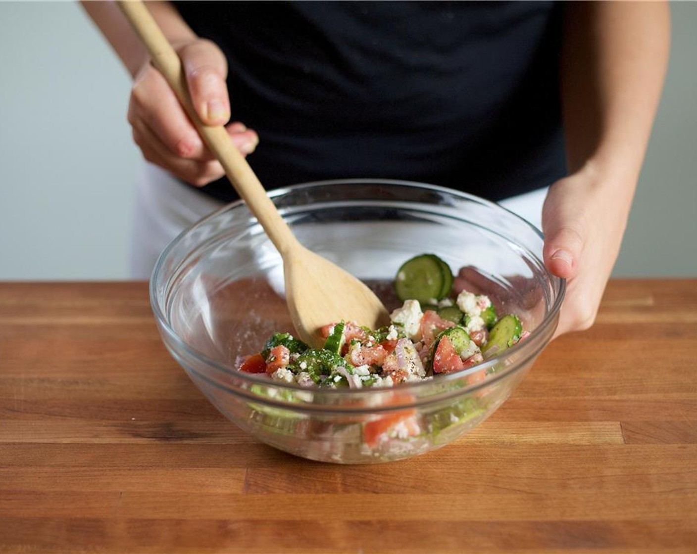 step 7 Add Olive Oil (1 Tbsp), Red Wine Vinegar (1/2 Tbsp), Feta Cheese (2/3 cup), Salt (1/4 tsp) and Ground Black Pepper (1/4 tsp) to the large bowl with the salad ingredients. Gently mix the ingredients together and set aside.