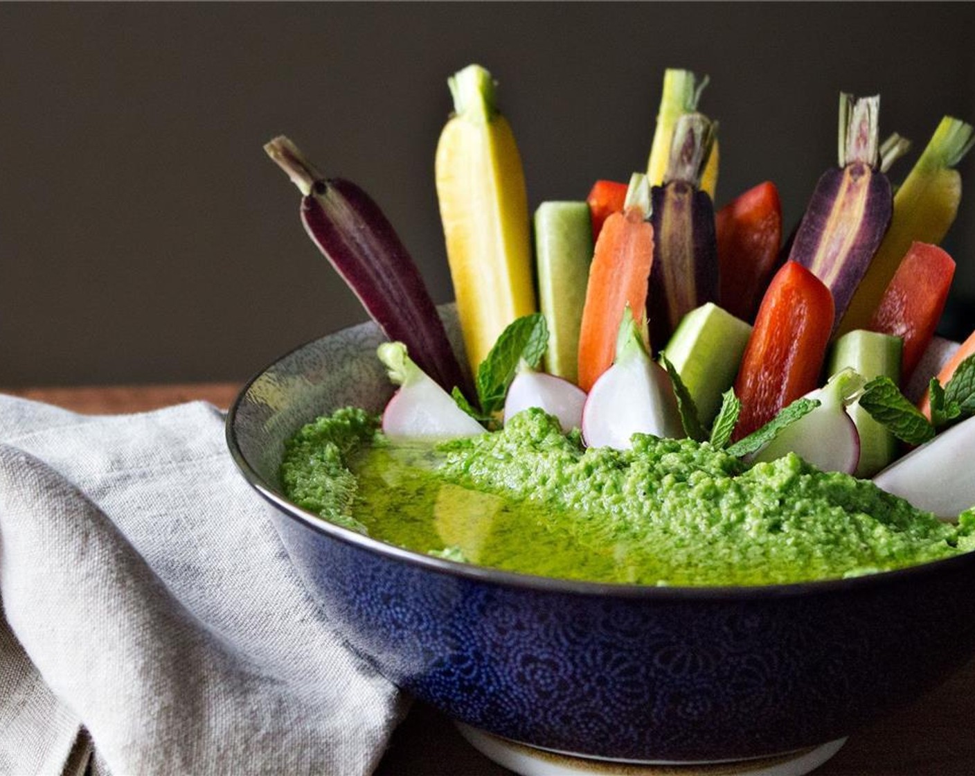 step 4 Scoop hummus into a medium size bowl and arrange your choice of crudites within or serve on the side. Add a small pool of Extra-Virgin Olive Oil (1 Tbsp), serve and enjoy!