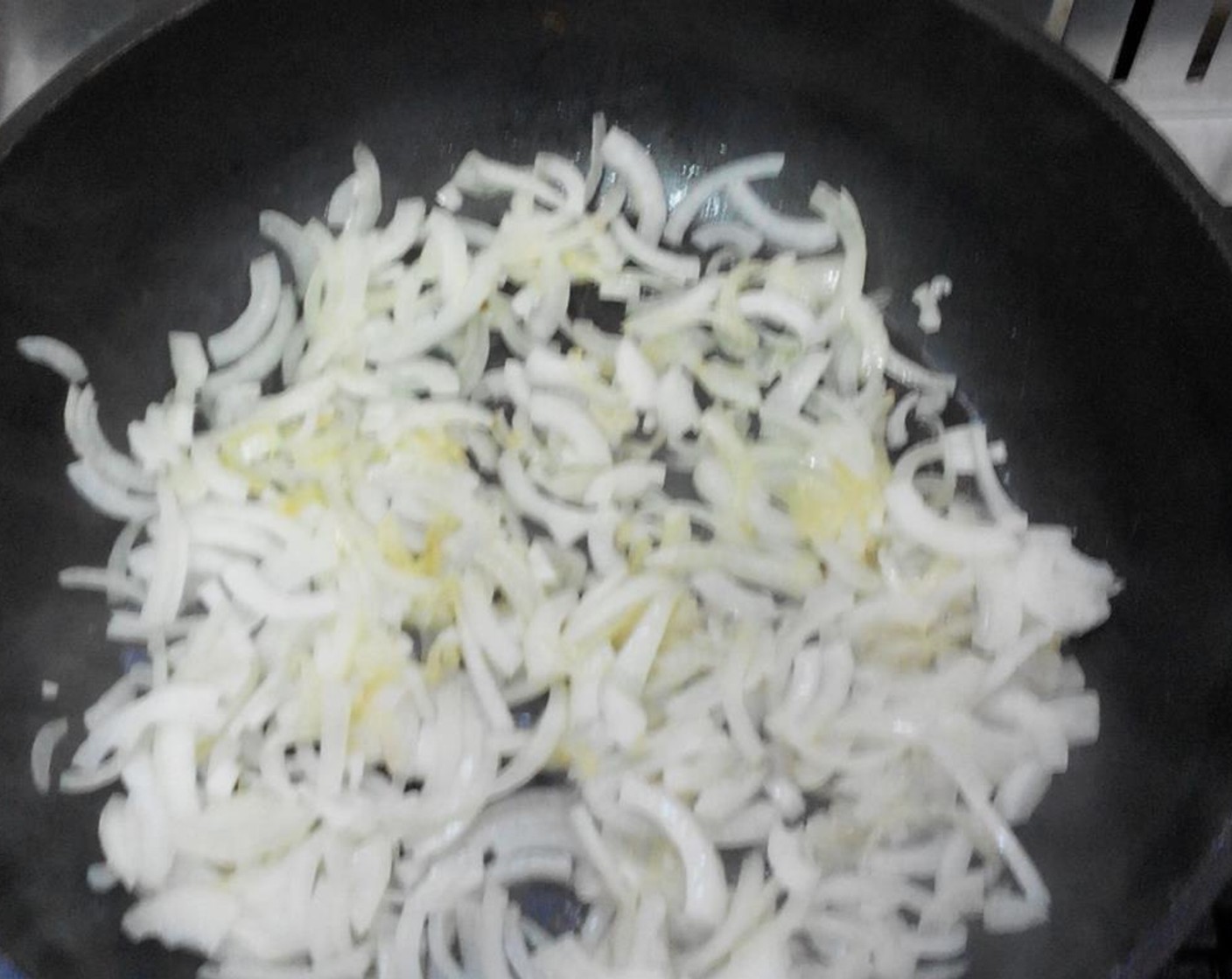 step 2 Pour the Olive Oil (3 Tbsp) into a large, deep pan and start heating it on the stove over medium. Add the chopped onions.