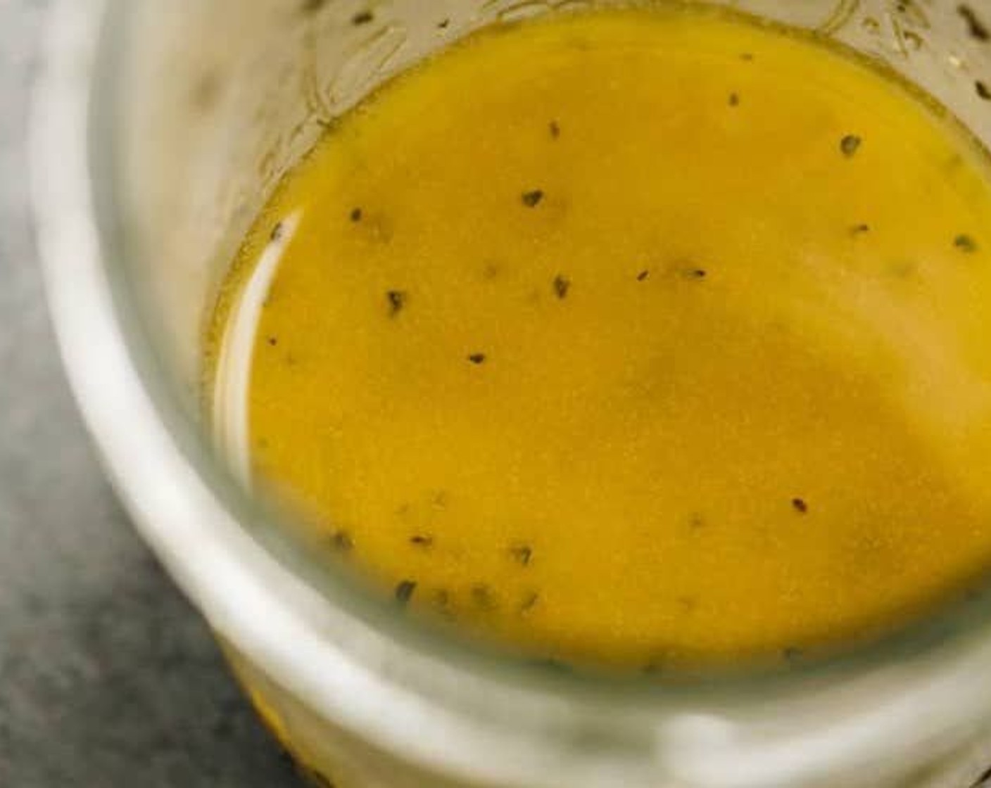 step 1 Add Olive Oil (4 Tbsp), Red Wine Vinegar (2 Tbsp), Dijon Mustard (1 tsp), Simply Organic Garlic Powder (1/2 tsp), Dried Oregano (1/2 tsp), Salt (1/2 tsp), and Ground Black Pepper (1/4 tsp) to a jar with a lid. I use a mason jar. Shake vigorously to combine all ingredients.