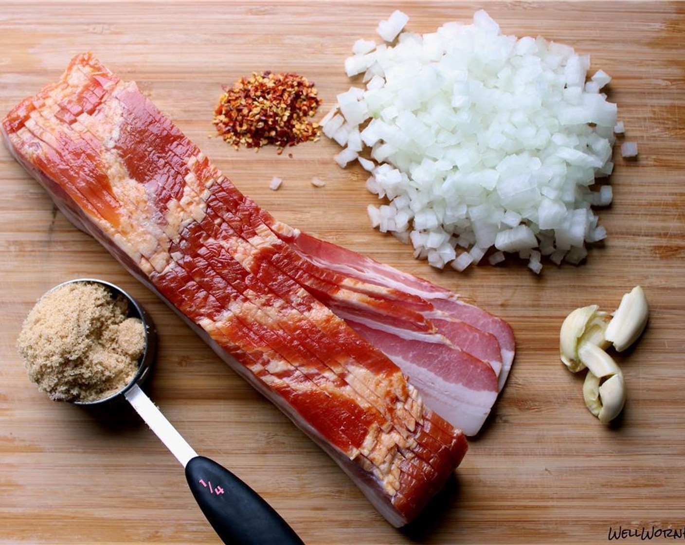 step 1 Chop the Bacon (8 oz) and render it in a medium saucepan until crispy. Remove bacon and set aside. Pour out most of the bacon fat, but leave enough to coat the pan. Give a small dice to the Garlic (2 cloves) and Yellow Onion (1).