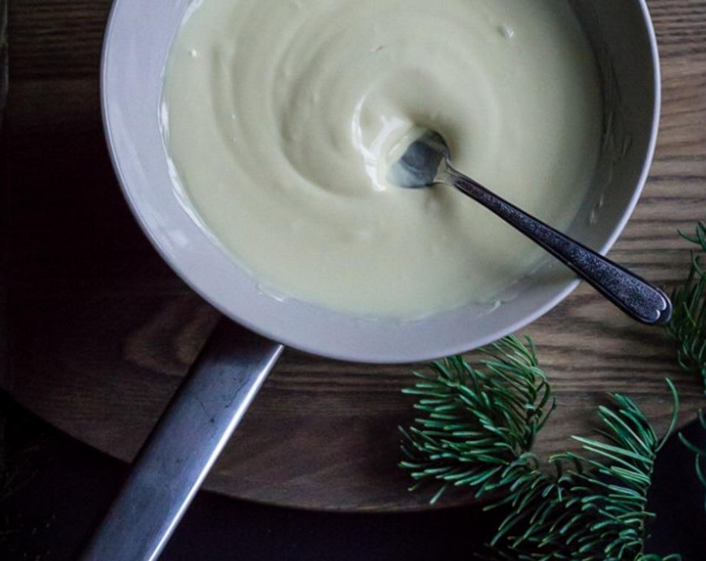 step 9 Remove white chocolate from the double boiler, stir until perfectly smooth, and then scoop white chocolate into a piping bag fitted with a #2 icing tip.