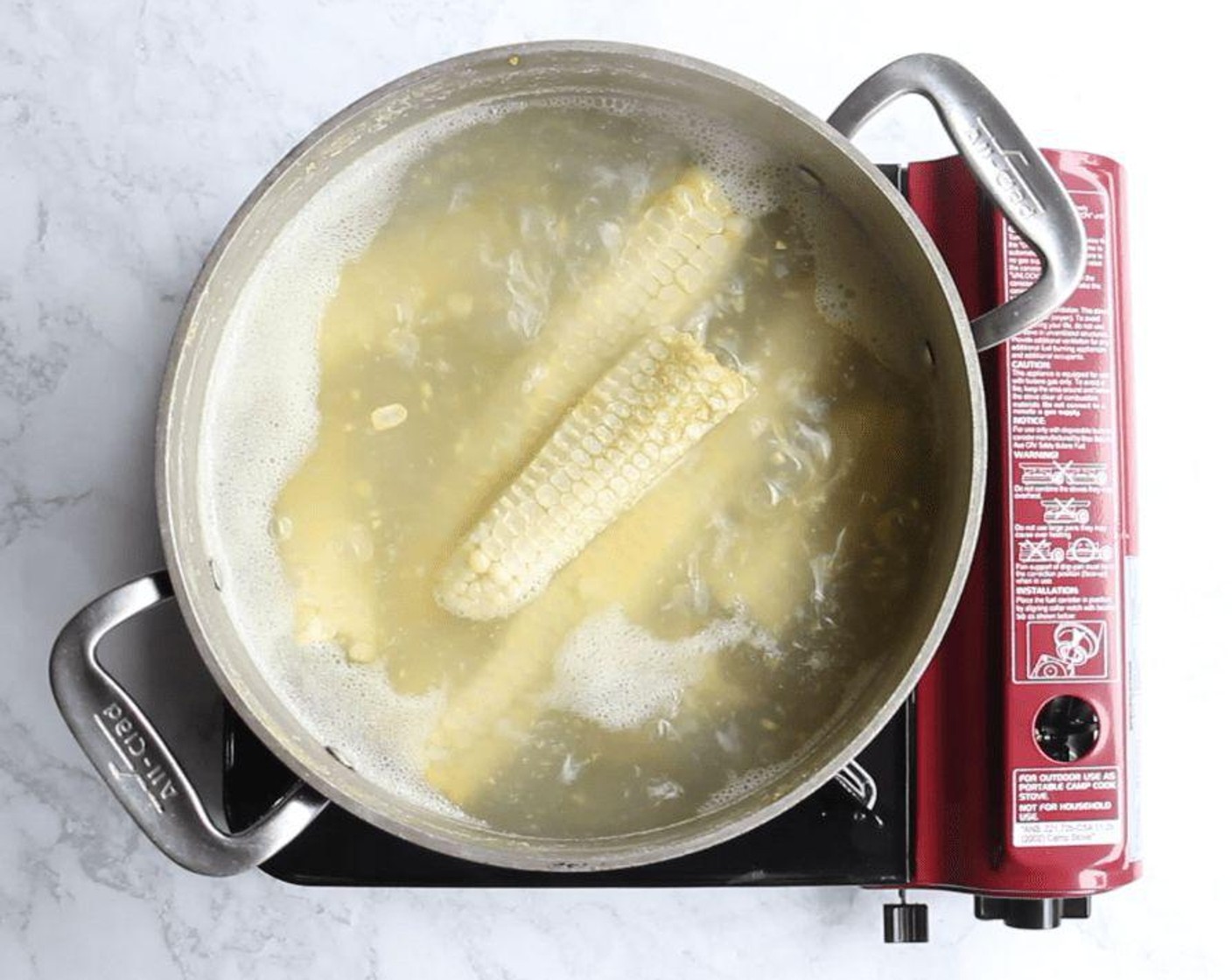 step 2 In a soup pot, quickly make a corn cob stock: cover the cobs with Water (9 cups) and bring to a boil. Reduce heat and simmer for 10 minutes, then remove the cobs. Set stock aside.