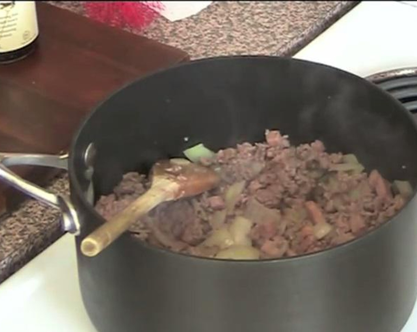 step 2 After a while, add the Ground Beef (1.1 lb) to the pot and cook over high heat.