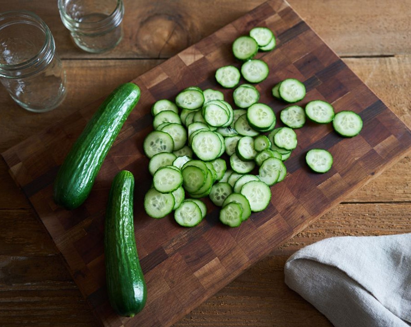 step 2 Slice the Persian Cucumber (1 cup) in to thin rounds and add to vinegar mixture.
