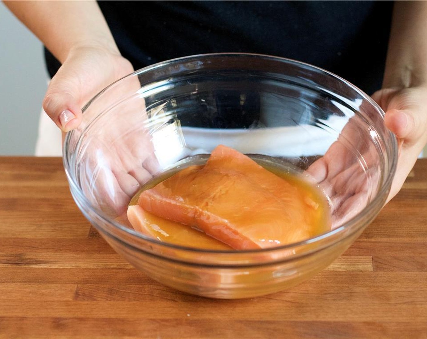 step 6 Pat dry Salmon Fillets (2) with paper towels. Place the salmon fillets in the medium bowl with the marinade, coat on both sides and allow to marinate for ten minutes.