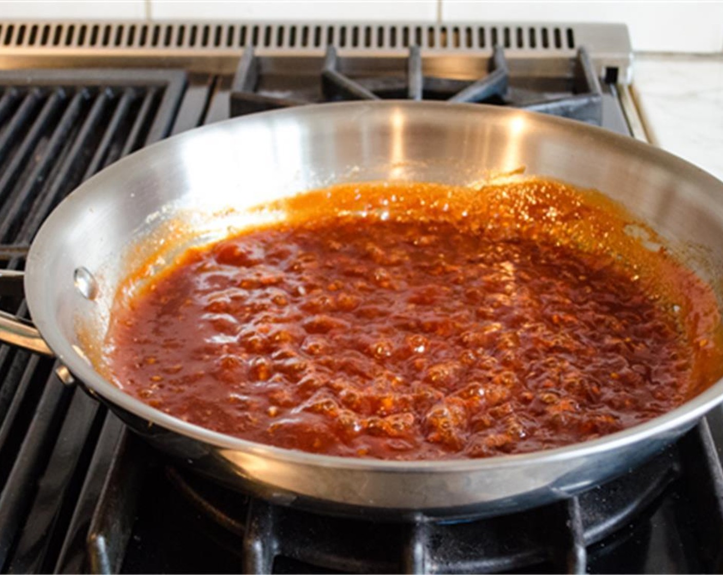 step 8 Meanwhile, in a large sauté pan, mix together Ketchup (1/2 cup), Dark Brown Sugar (1/2 cup), Water (2 Tbsp), Apple Cider Vinegar (1 1/2 Tbsp), Worcestershire Sauce (1/2 Tbsp), Shallot (1 Tbsp), Garlic (1 clove), Ground Black Pepper (1/8 tsp), and Salt (1/2 tsp) for the sauce. Bring to a simmer and cook gently until thickened, about 10 minutes.