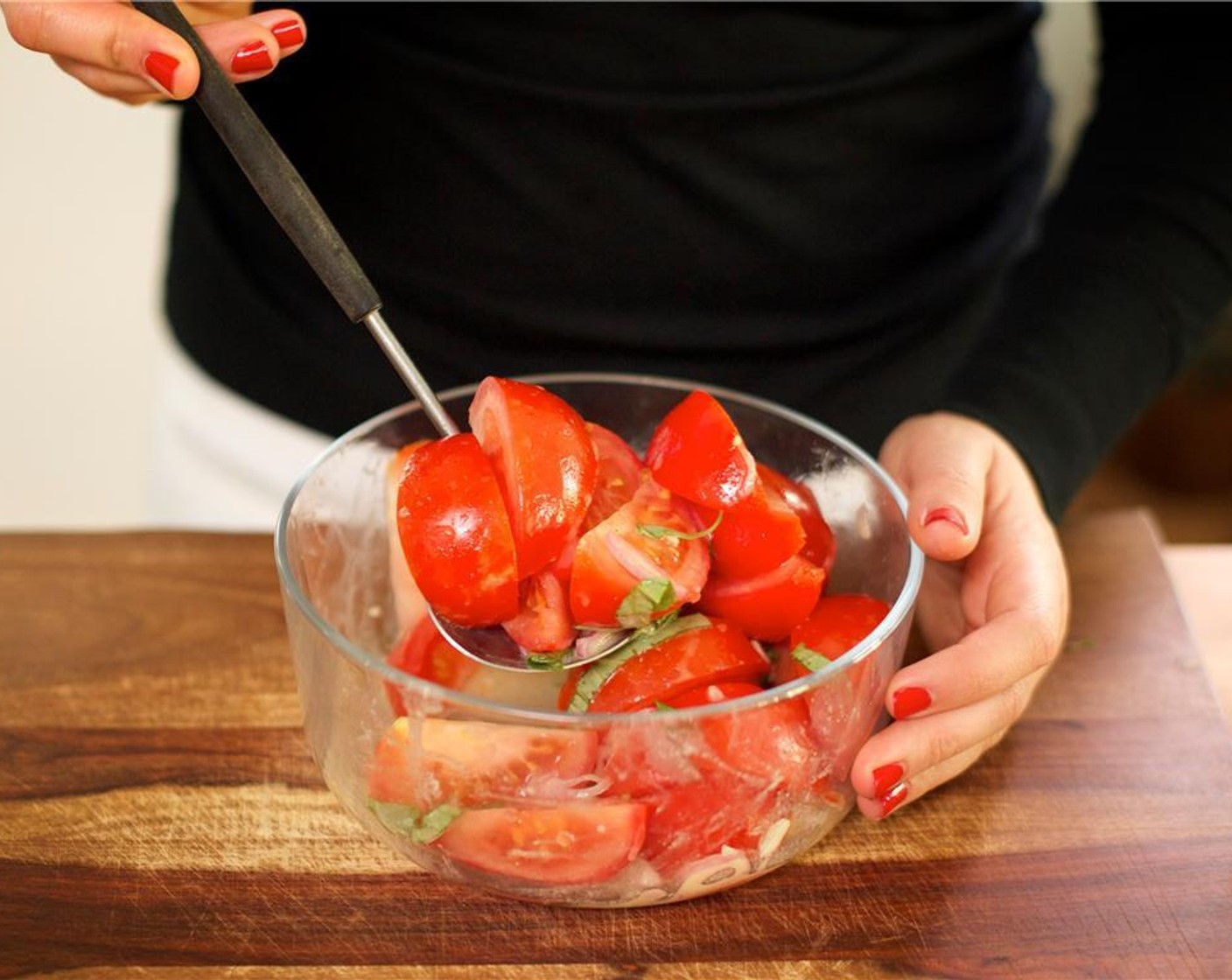 step 4 Cut each Tomatoes (2) into wedges of eight and add them to the bowl with the shallots. Add the dressing and the sliced basil, toss gently, and hold for plating.