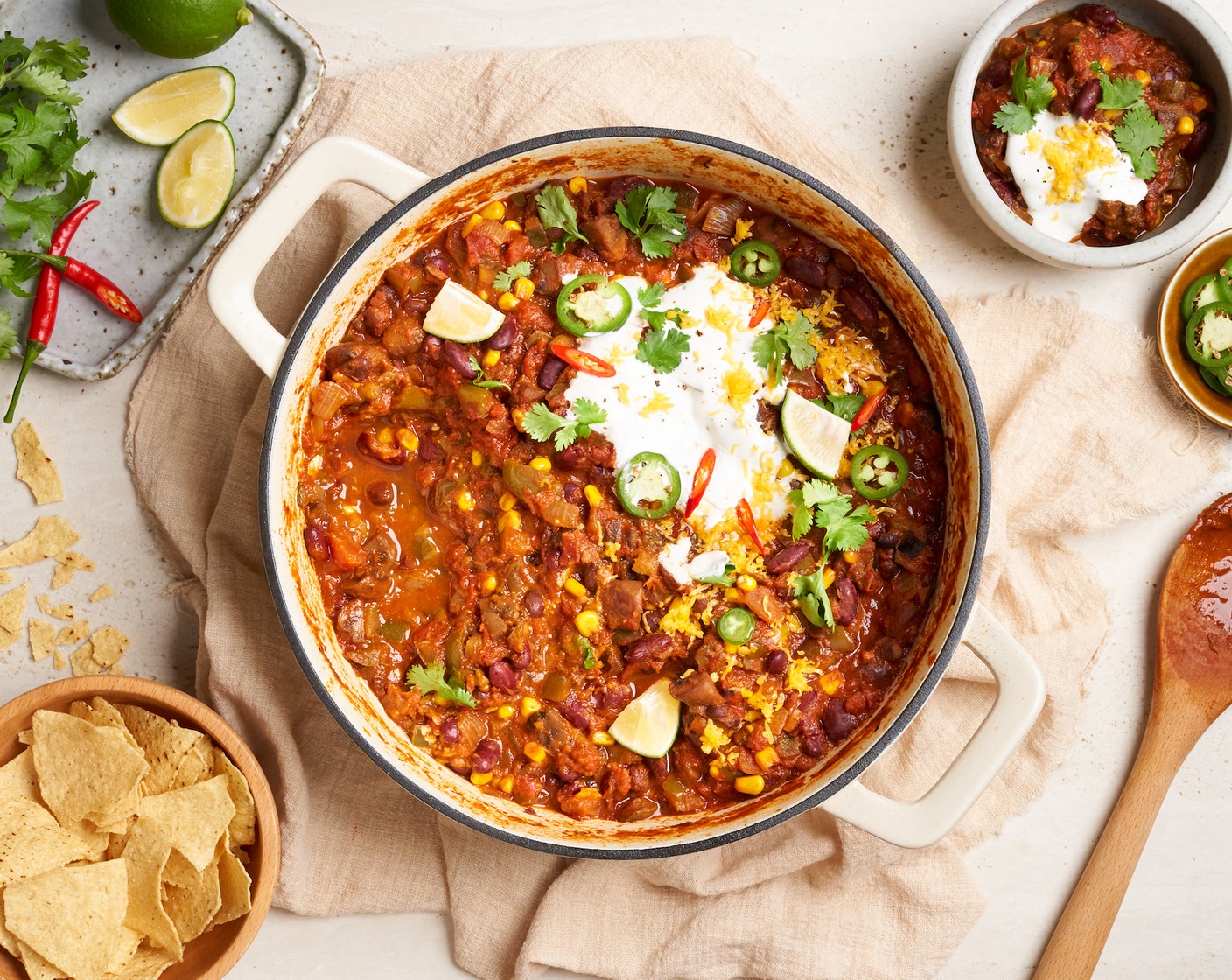 step 9 Serve the vegetarian chili hot in bowls. Top each serving with a dollop of Sour Cream (3 Tbsp), Fresh Cilantro Leaf (1/4 cup), Cheddar Cheese (1/4 cup), and Tortilla Chips (6 1/2 cups) for some added crunch.