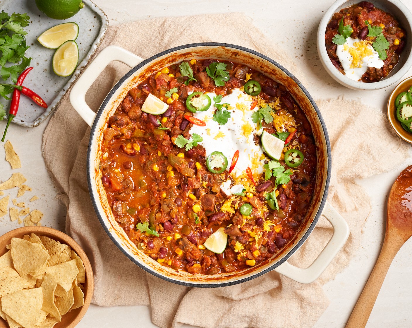 step 9 Serve the vegetarian chili hot in bowls. Top each serving with a dollop of Sour Cream (3 Tbsp), Fresh Cilantro Leaves (4 Tbsp), Cheddar Cheese (4 Tbsp), and Tortilla Chips (6 1/2 cups) for some added crunch.