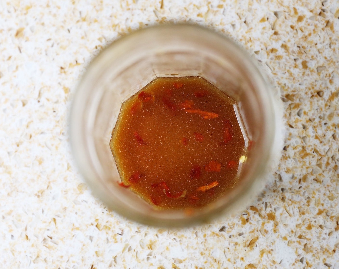 step 8 Make the dressing by combining the Korean Chili Flakes (1/2 tsp), Soy Sauce (1 tsp), Fish Sauce (1 tsp), Rice Vinegar (1 Tbsp) and Sesame Oil (1 tsp) in a jar. Screw the lid on and give it a good shake. Set aside.