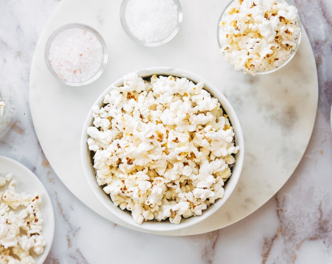 step 7 Add your browned butter and Sea Salt (1 tsp) to your popcorn and fold with a spatula to make sure every kernel is covered with that beautiful butter and top with salt.