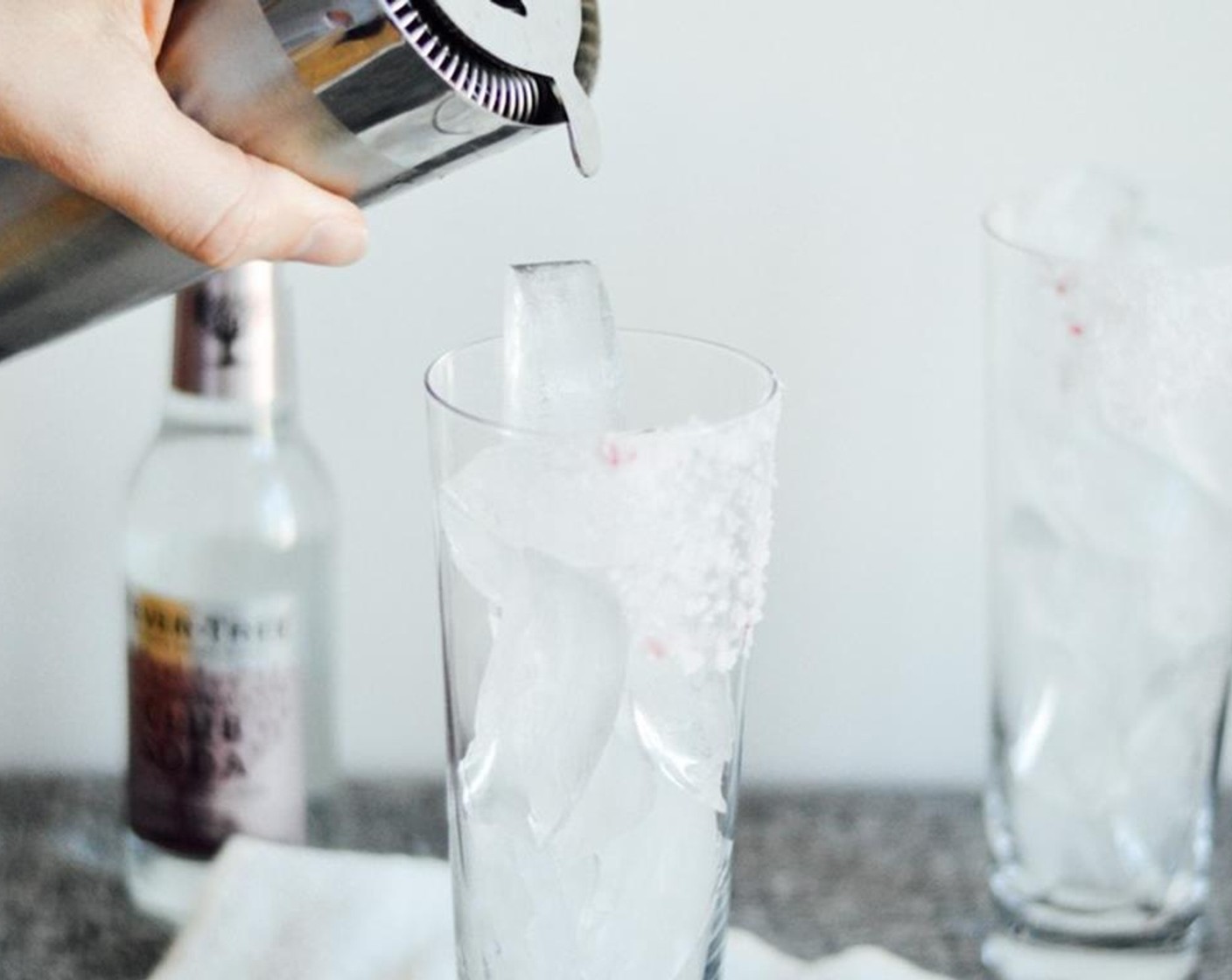 step 3 Fill the glass with Ice (to taste). Combine freshly squeezed blood orange juice, blood orange syrup, juice from Lime (1/2) and White Mezcal (1/4 cup) in a shaker. Shake for 20 seconds. Pour over the ice.