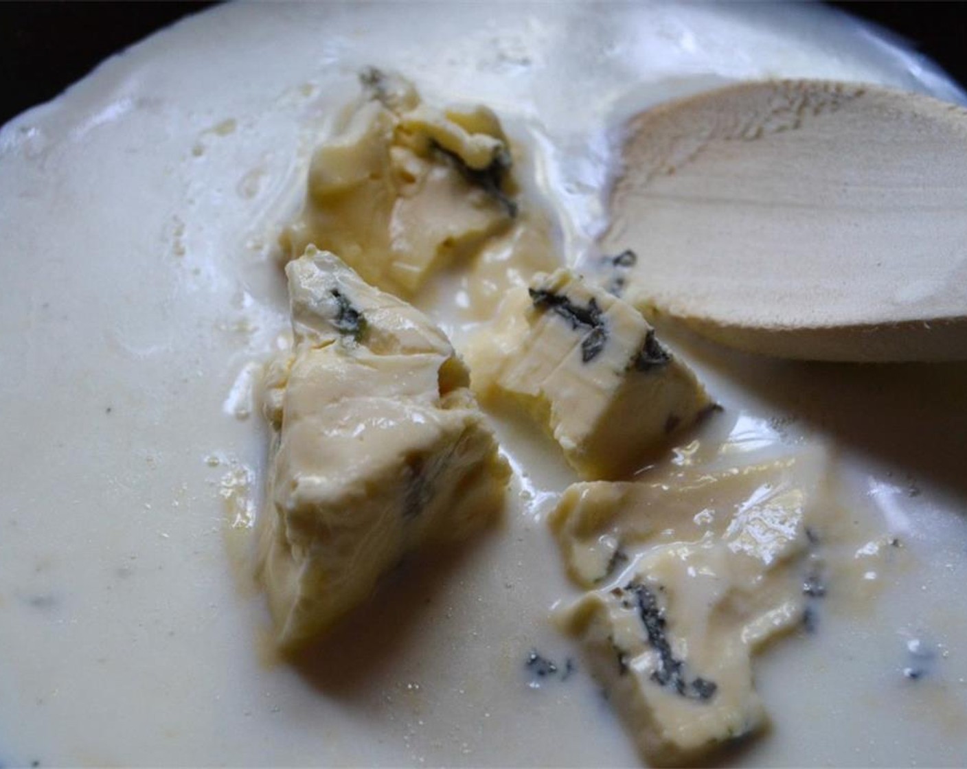 step 5 In a saucepan over low heat, gently melt the Stilton Blue Cheese (1 piece) in the Fresh Cream (1 cup).