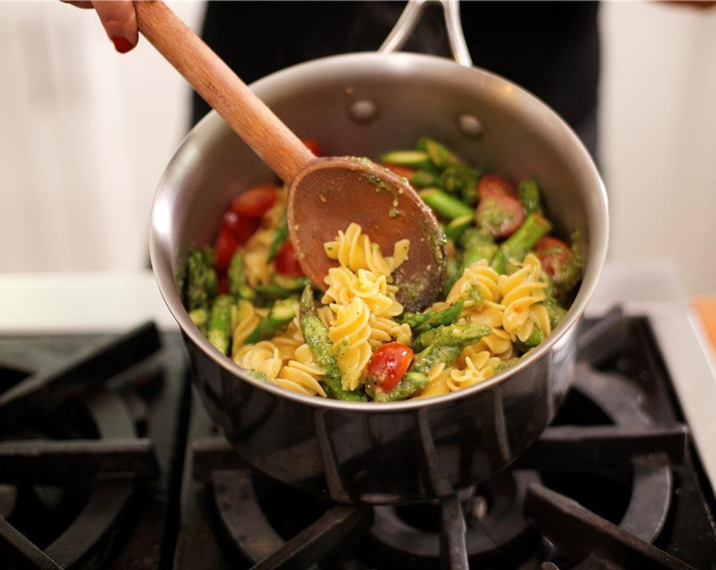 step 19 Remove vegetables from heat and add to the pasta, gently tossing to coat in the pesto.