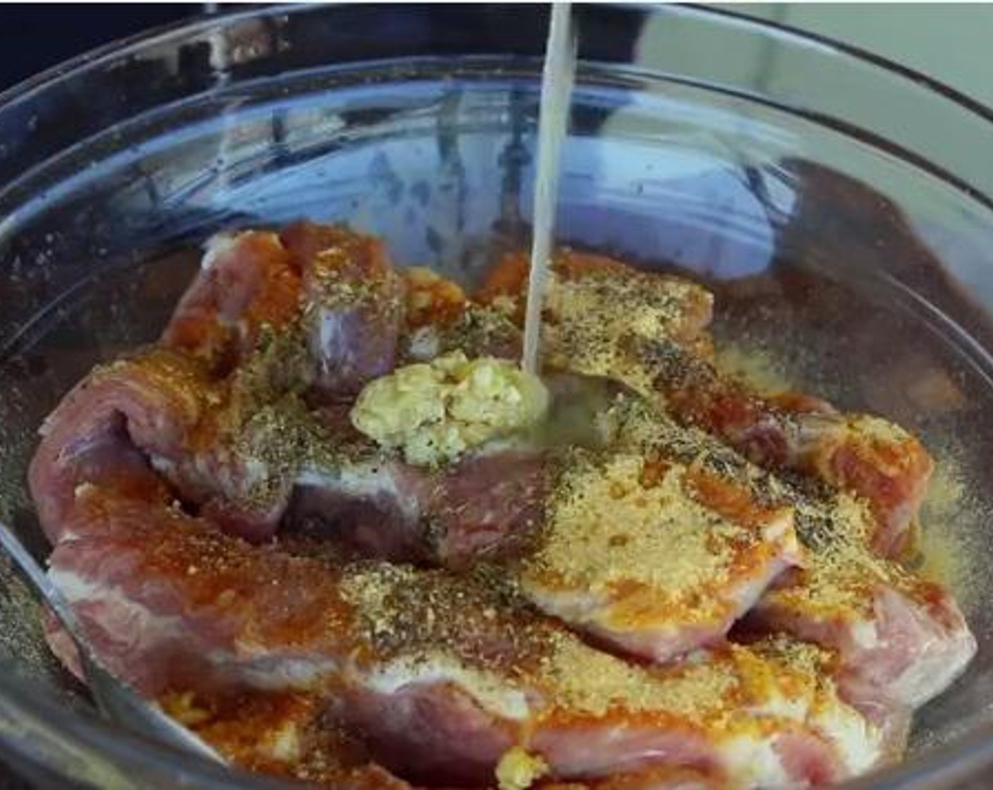 step 1 Remove the excess fat from the Spare Ribs (2 racks) and put them in a bowl. Add in the Dried Oregano (1 tsp), Garlic (4 cloves),Chicken Bouillon Powder (1 Tbsp), Ground Black Pepper (1/4 tsp), Soy Sauce (1 tsp), and juice from Lemons (2). Mix everything well.