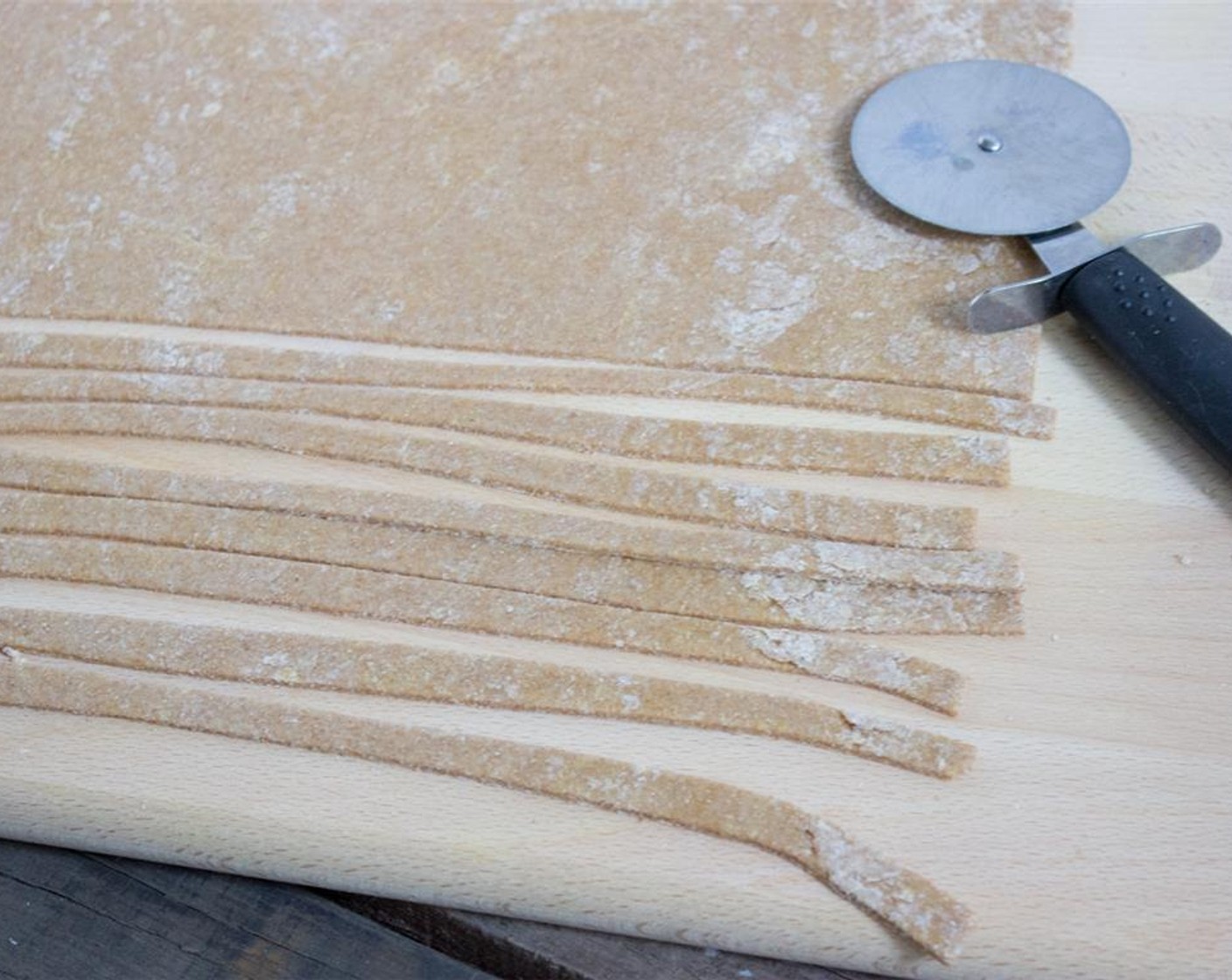 step 4 Cut dough into thin strips of pasta with pizza cutter.