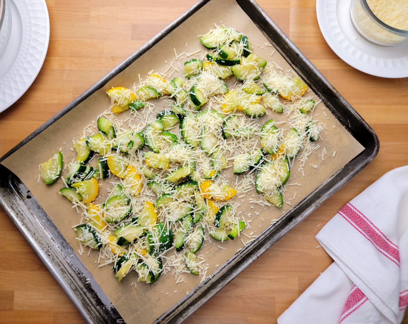 step 3 Spread the zucchini blend onto a lined sheet pan. Sprinkle the zucchini slices with Shredded Parmesan Cheese (3/4 cup).