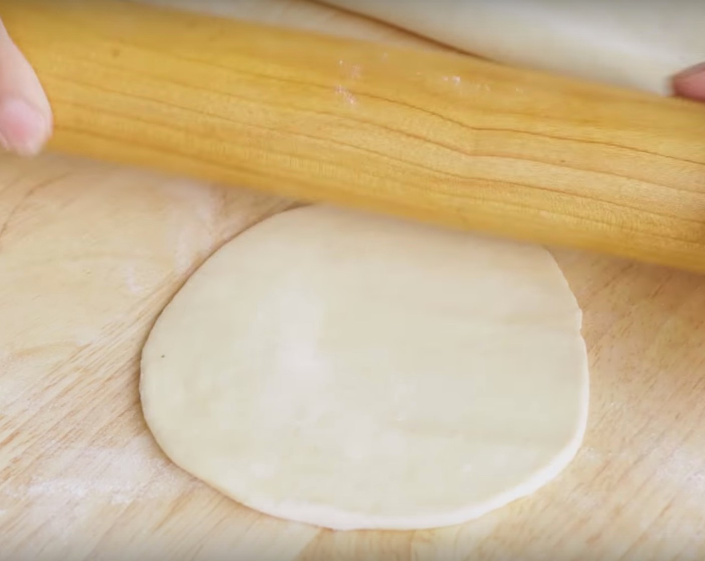 step 7 Take the dough out of the fridge. Roll out the dough into a thin sheet and cut out round disc shapes for empanadas.