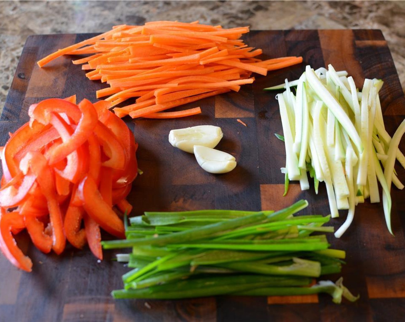 step 3 While the steak is marinating you can prep the filling. Chop up the Carrot (1), Zucchini (1/2) and Bell Pepper (1) into matchstick-size pieces, little longer than the width of the steak strips.