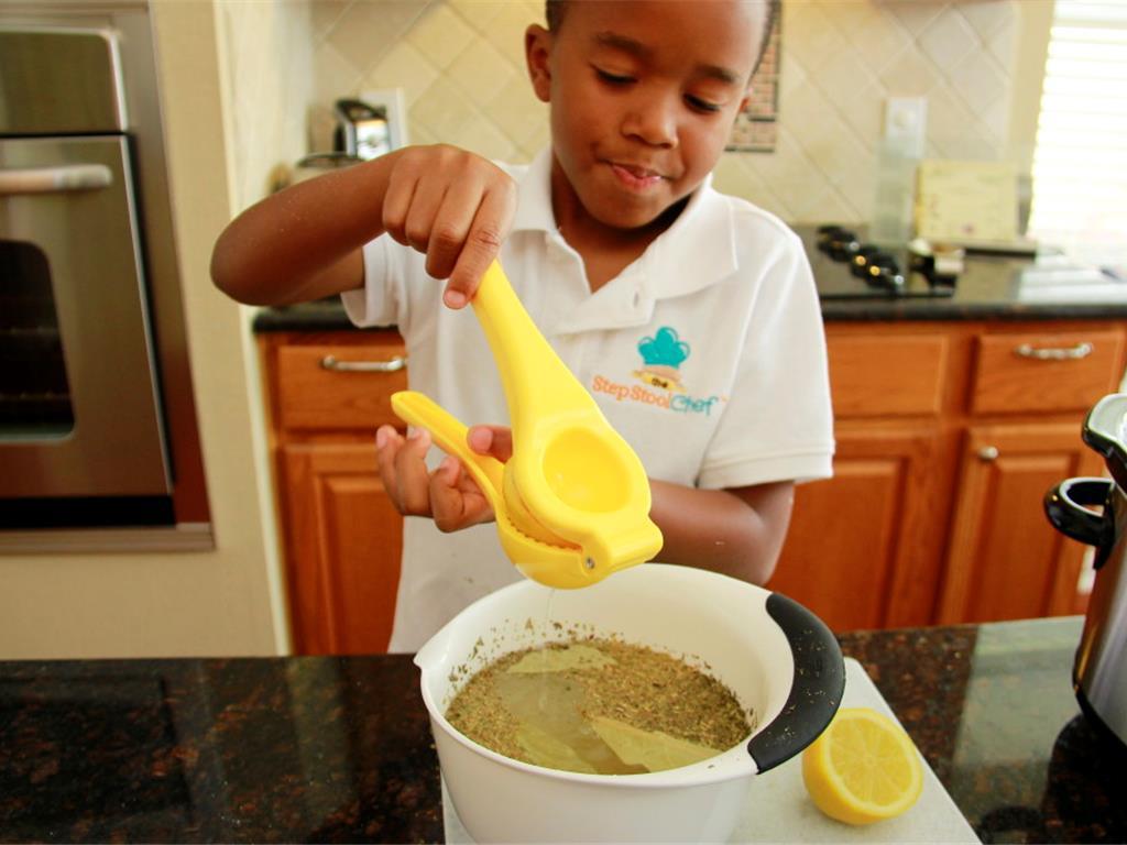 Step 4 of Rainy Day Stewed Chicken & Veggies Recipe: In a bowl, add Water (4 cup), Bay Leaf (2), Onion Powder (1 teaspoon), Garlic Powder (1 teaspoon), Dried Basil (1 teaspoon), Dried Oregano (1 teaspoon), and Dried Thyme (1 teaspoon). Juice the Lemon (1/2) into the bowl. Pour mixture in slow cooker.