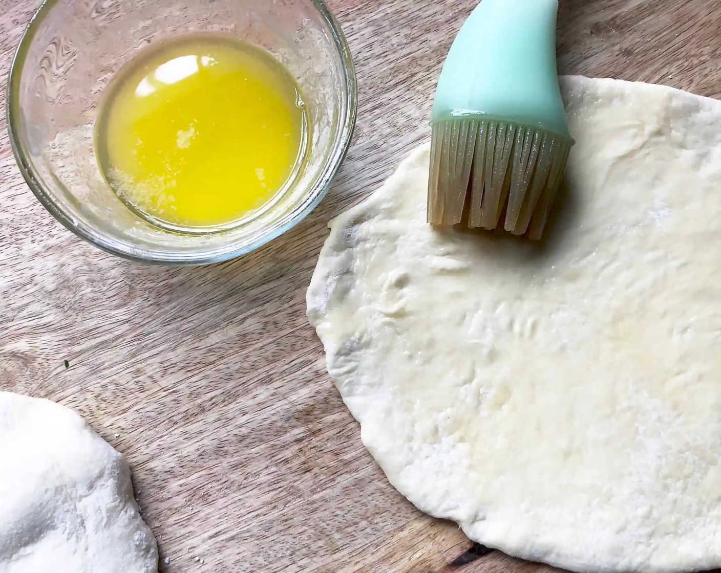 step 9 Melt Salted Butter (1/4 cup). Lightly brush both sides of each dough oval with the melted butter as you proceed.