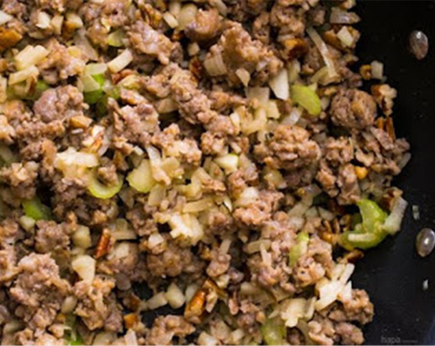 step 4 In a large saute pan over medium-high heat, add the pork sausage. Stirring frequently, breaking the pork up into small pieces. Cook for 10 minutes or until cooked through. Drain and set aside.