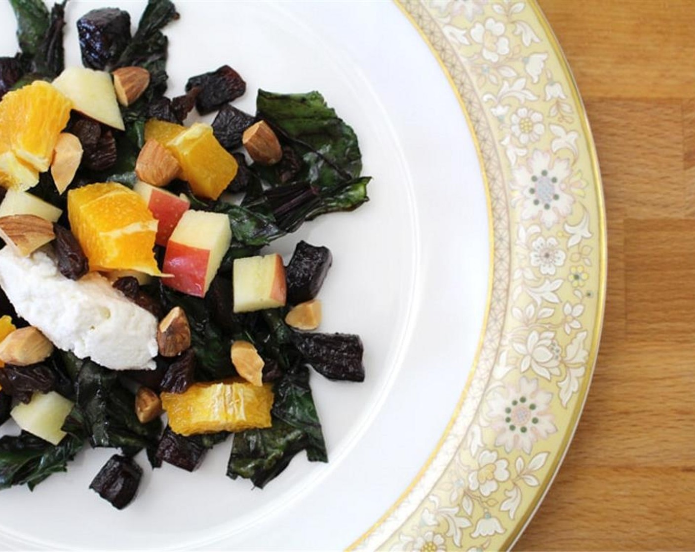 step 4 Top beets and greens with Oranges (4 Tbsp), Apples (4 Tbsp), Almonds (2 Tbsp), and Sun-Maid Raisins (2 Tbsp).