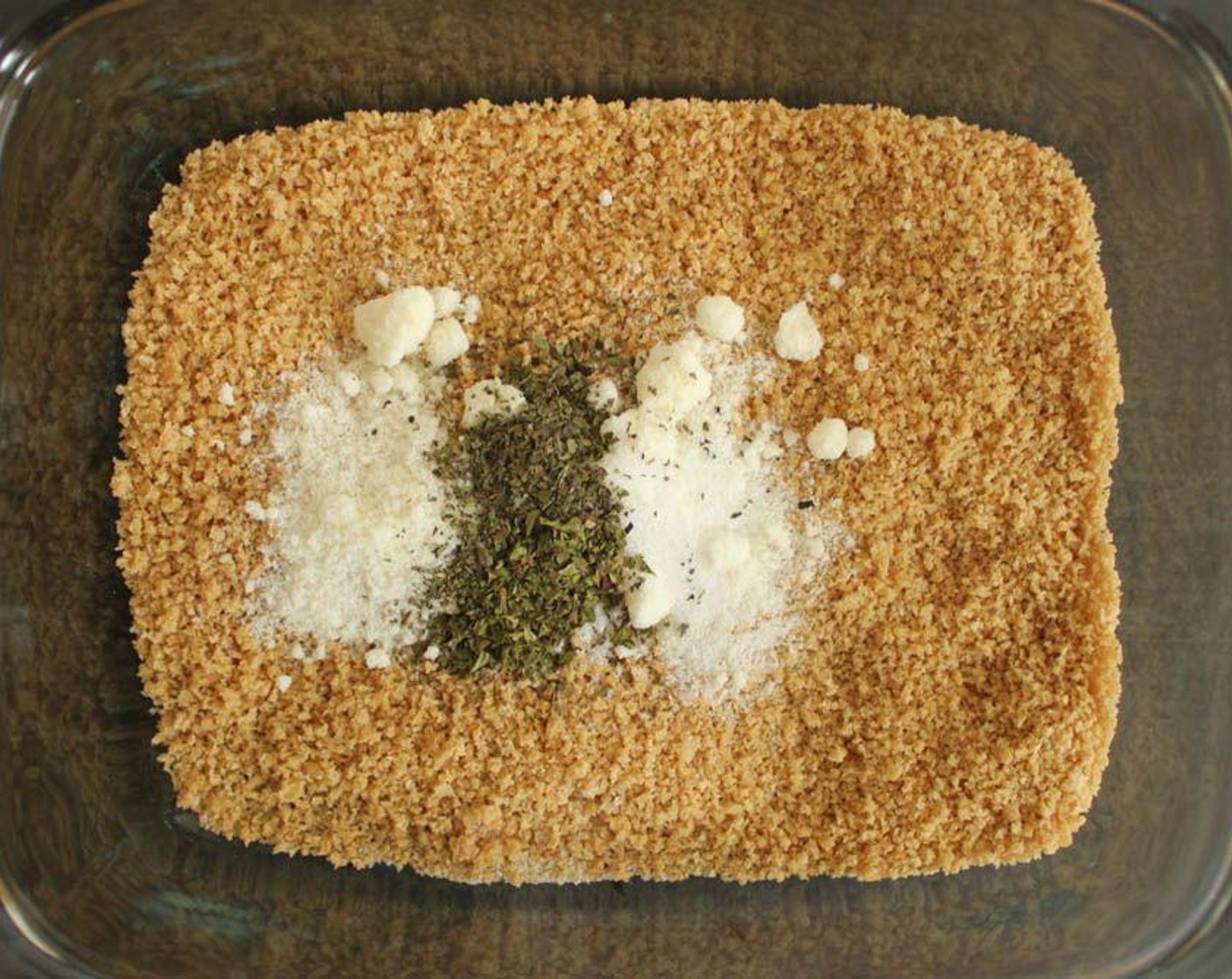 step 5 Now it’s time to prepare the breading for the cutlets. In a shallow baking dish, combine the Whole Wheat Panko Breadcrumbs (1 cup), Grated Parmesan Cheese (2 1/2 Tbsp), Salt (1/4 tsp), Dried Basil (1/2 tsp), Dried Oregano (1/2 tsp), and Cayenne Pepper (1 pinch).