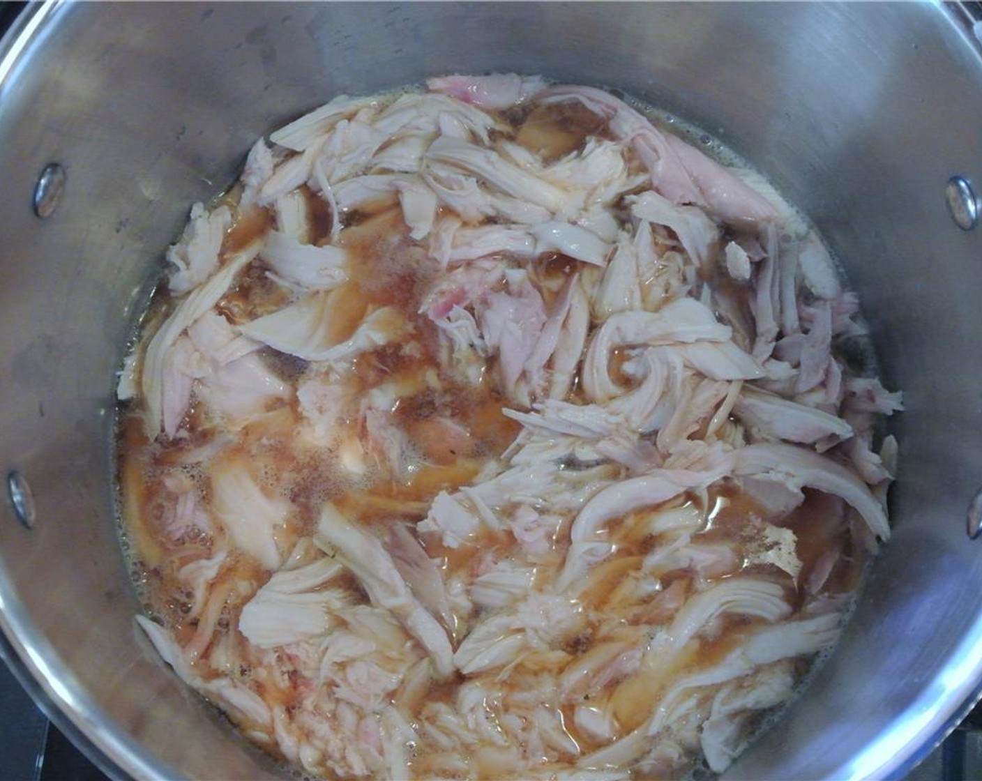 step 2 Put chicken meat into a large pot, and pour a Beer (1 can) over the chicken until just covered.