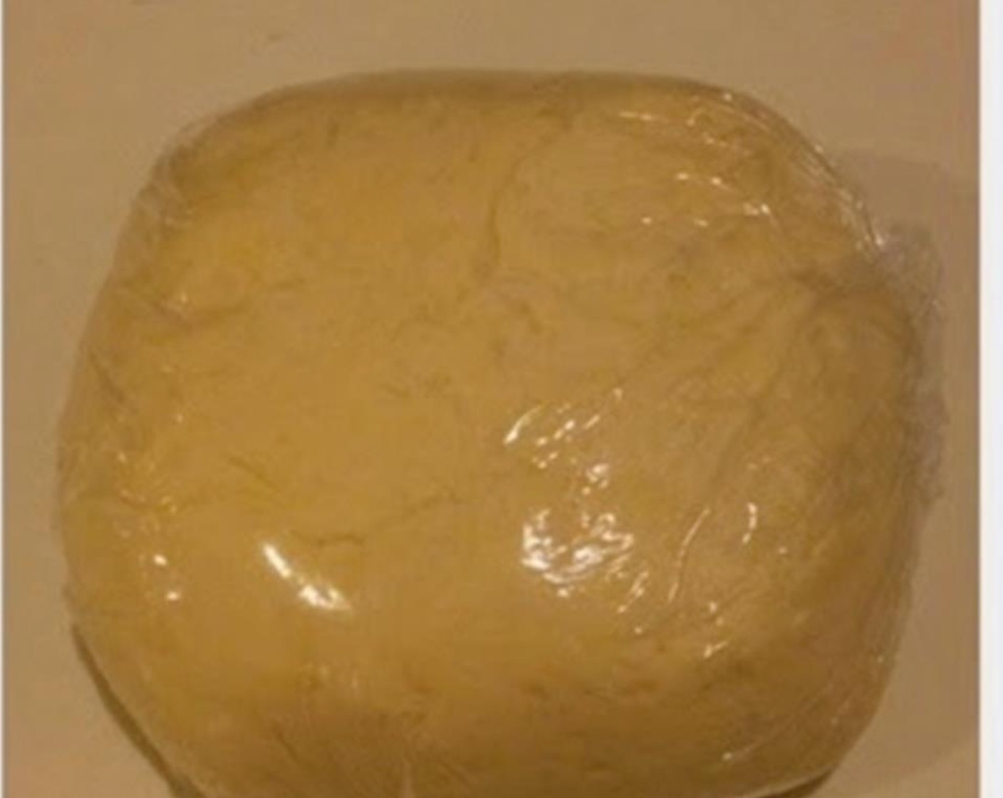 step 2 Make a well in the middle and pour in Butter. Combine the Buttermilk (3/4 cup) with flour and transfer to a table for kneading. Knead until the dough reaches a smooth surface. Wrap with cling wrap and rest in the fridge for 30 minutes.