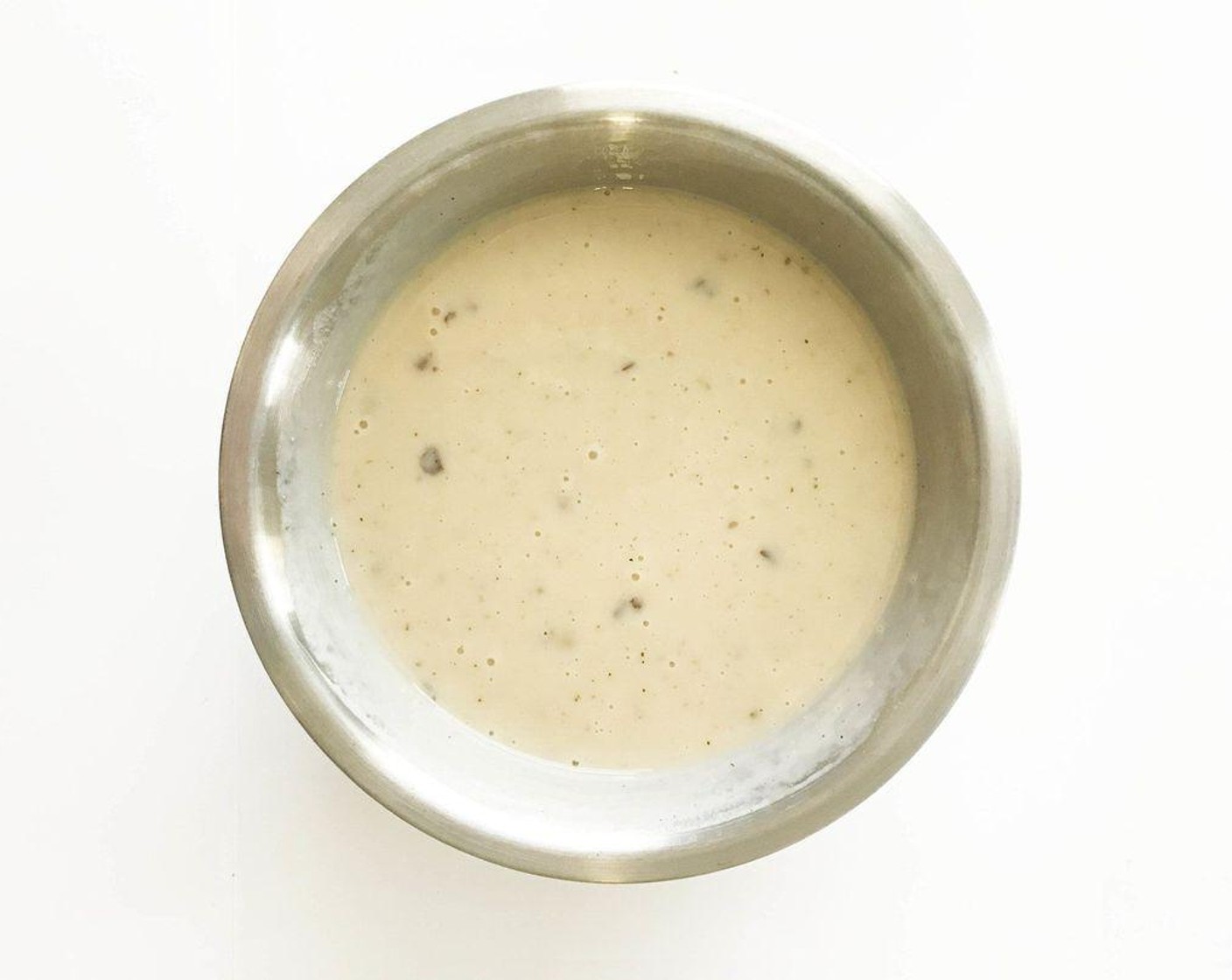 step 6 Whisk together the Cream of Mushroom Soup (310 g), Cream of Chicken Soup (310 g), and Fat-Free Evaporated Milk (150 mL) in a large bowl.