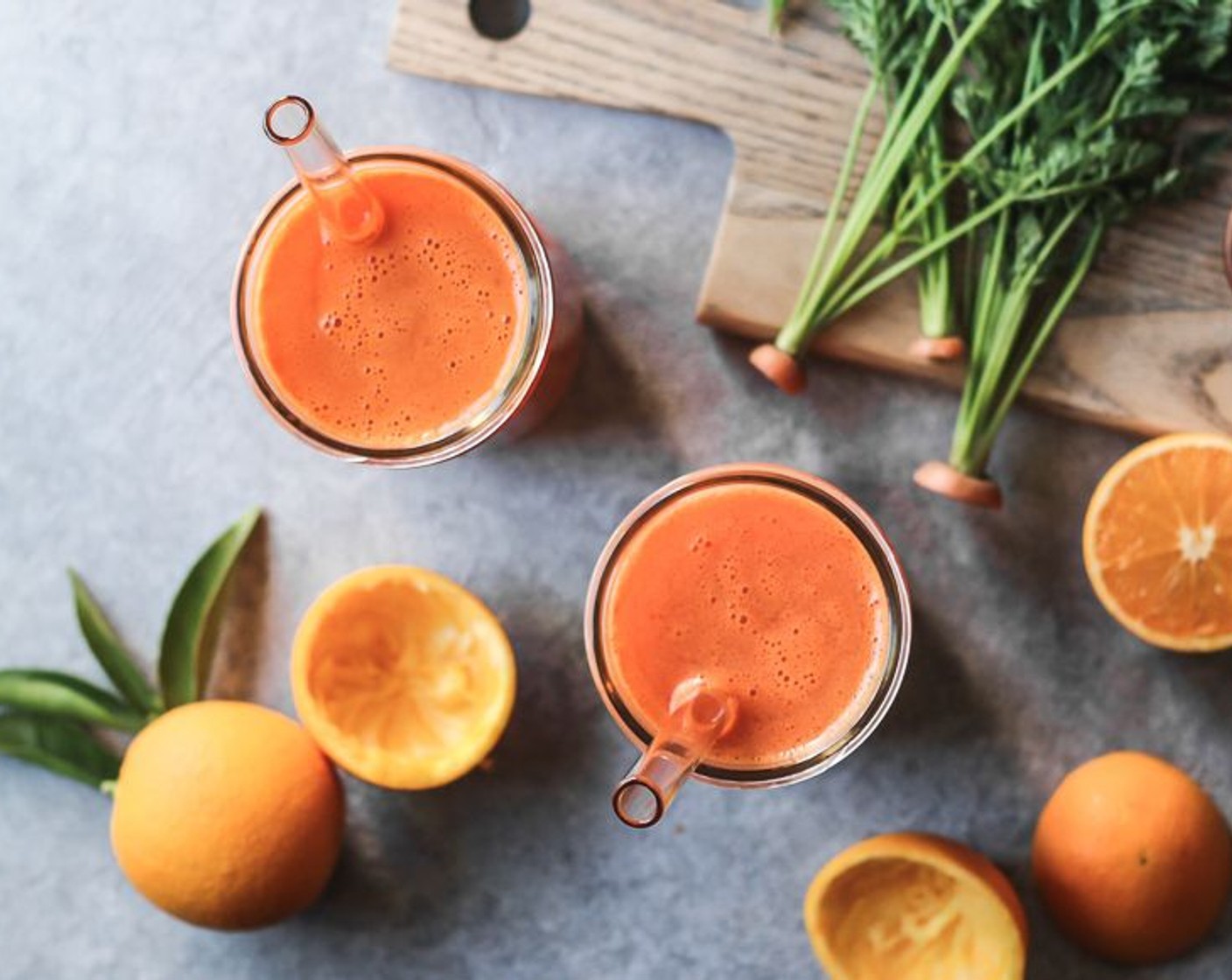 step 3 Pour the carrot ginger juice and orange juice into a glass jar that holds 24 ounces or two smaller ones. Add a straw and enjoy!