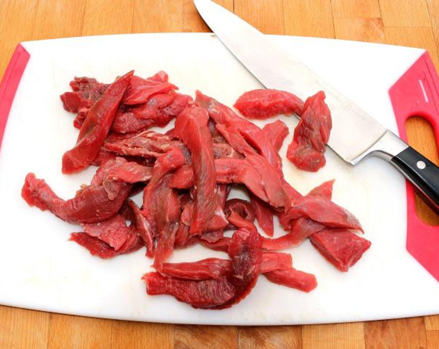 step 1 Cut the T-Bone Steak (1.3 lb) into strips, then season with Kosher Salt (to taste) and Cayenne Pepper (to taste).