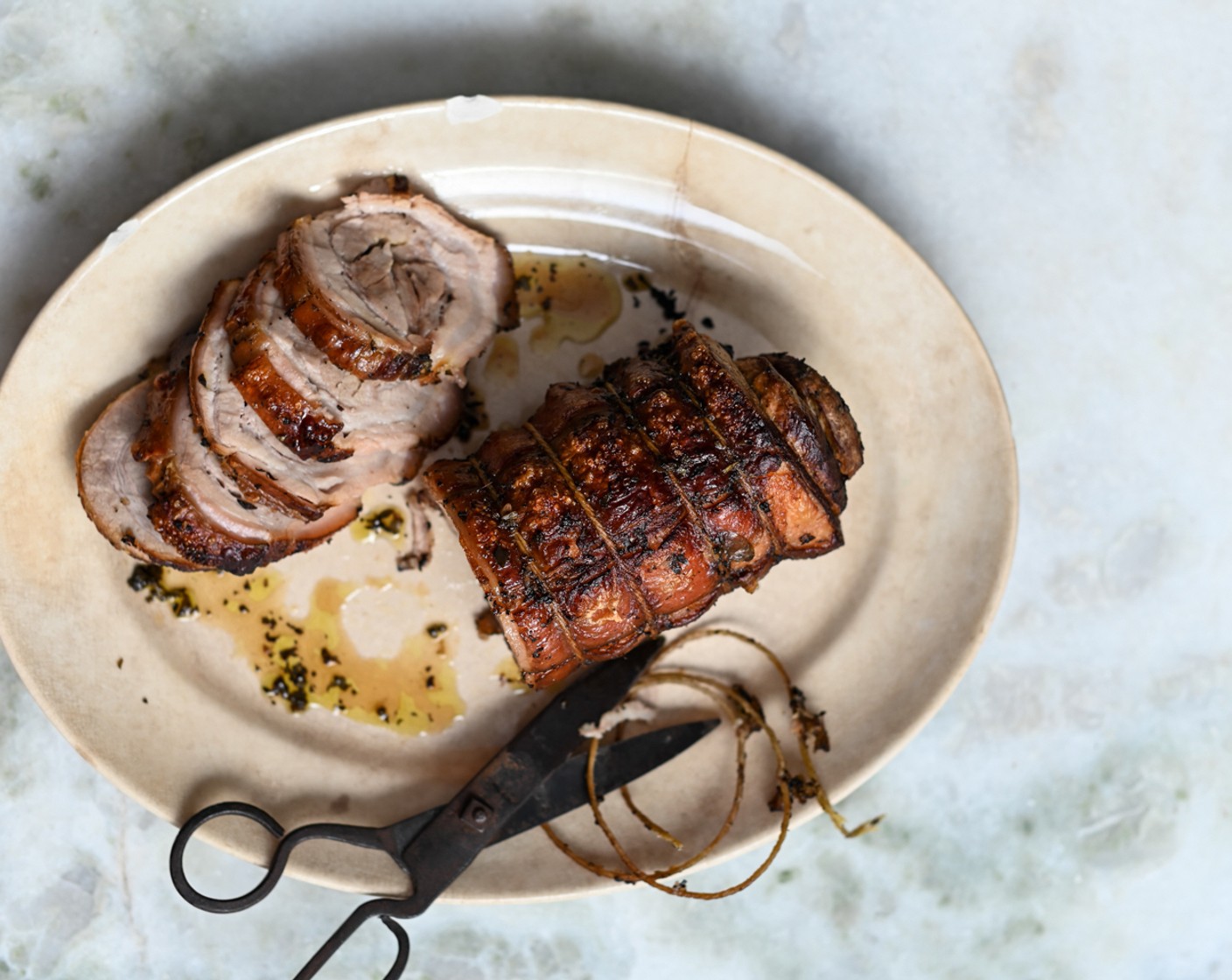 step 10 For extra crispy skin, give the porchetta a quick blast under the grill, turning once. Rest the pork for 5-10 minutes before slicing.