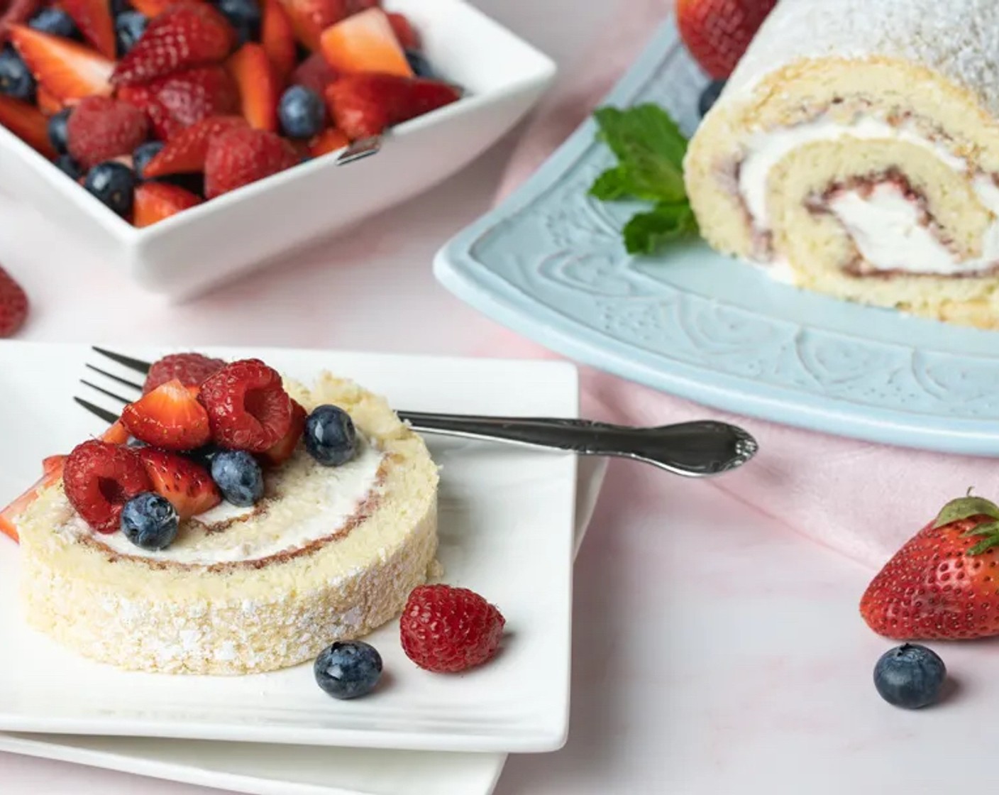 step 16 Transfer the cake to a serving platter and cut it into thick slices. Serve immediately with fresh macerated berries of choice.