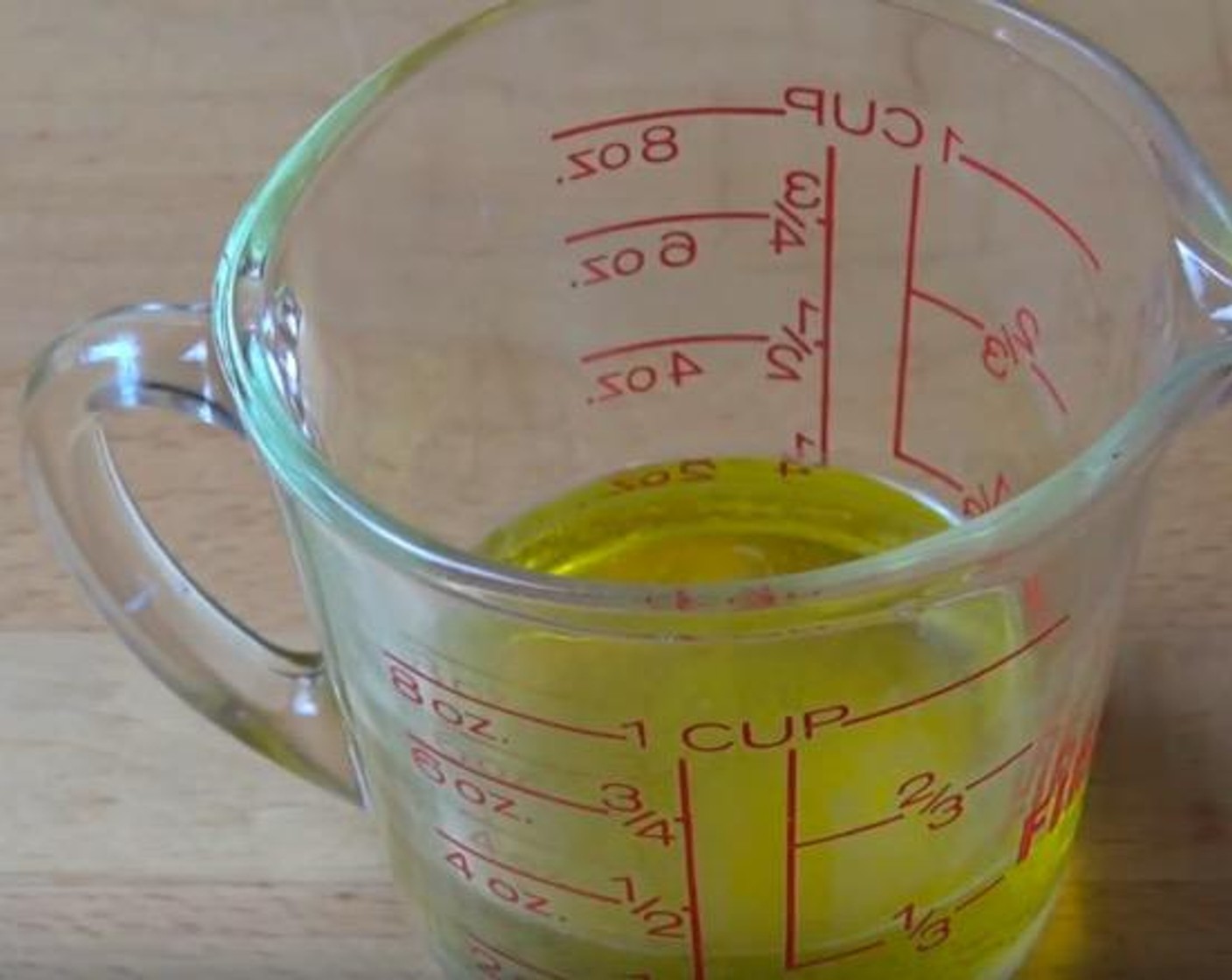 step 2 In a mixing jug, add Lemon (1/2), Extra-Virgin Olive Oil (1/3 cup), and Salt (to taste). Stir together.