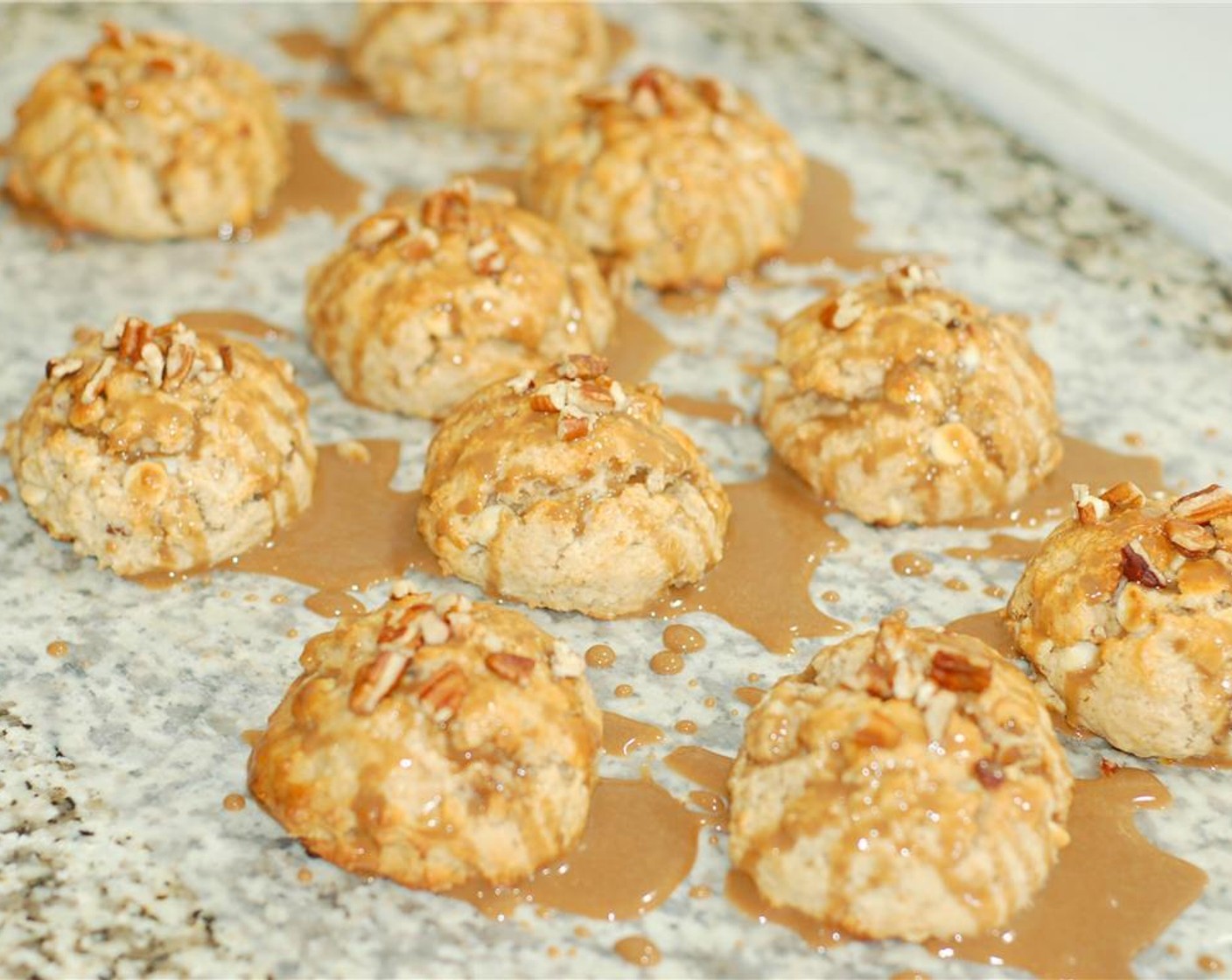 step 9 Using the whisk, drizzle the scones with as much or as little glaze as you prefer.