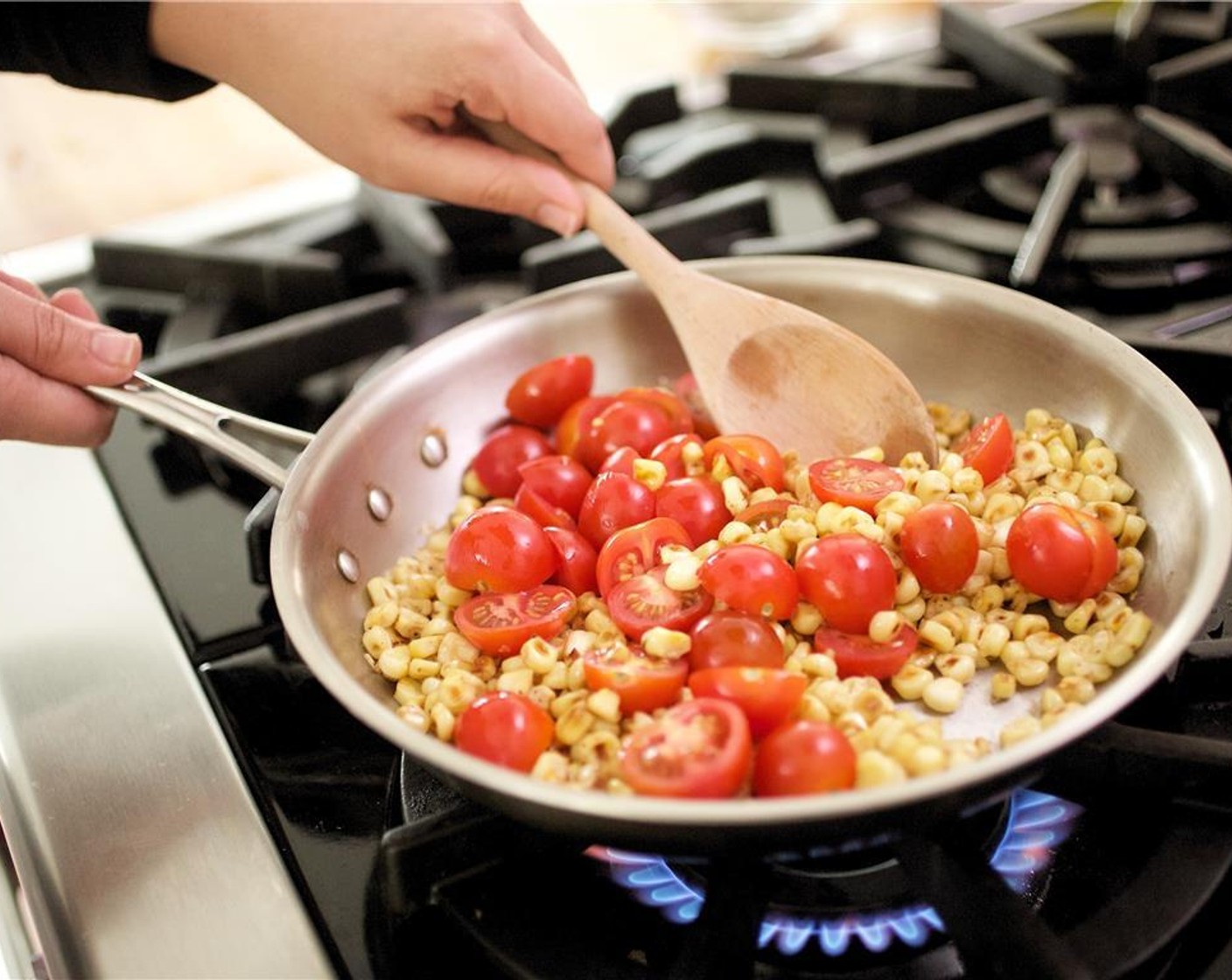 step 11 Add cherry tomatoes and a third of the cilantro. Season with salt and pepper to taste, and set aside.