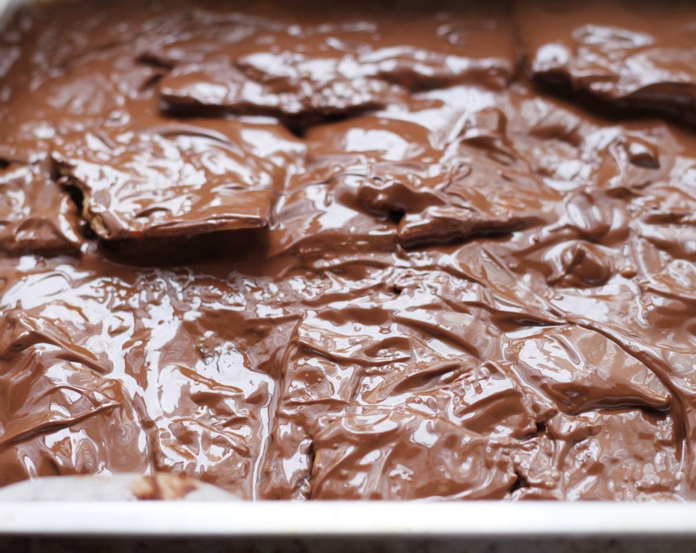 step 9 Evenly spread the melted chocolate with the back of a spoon.