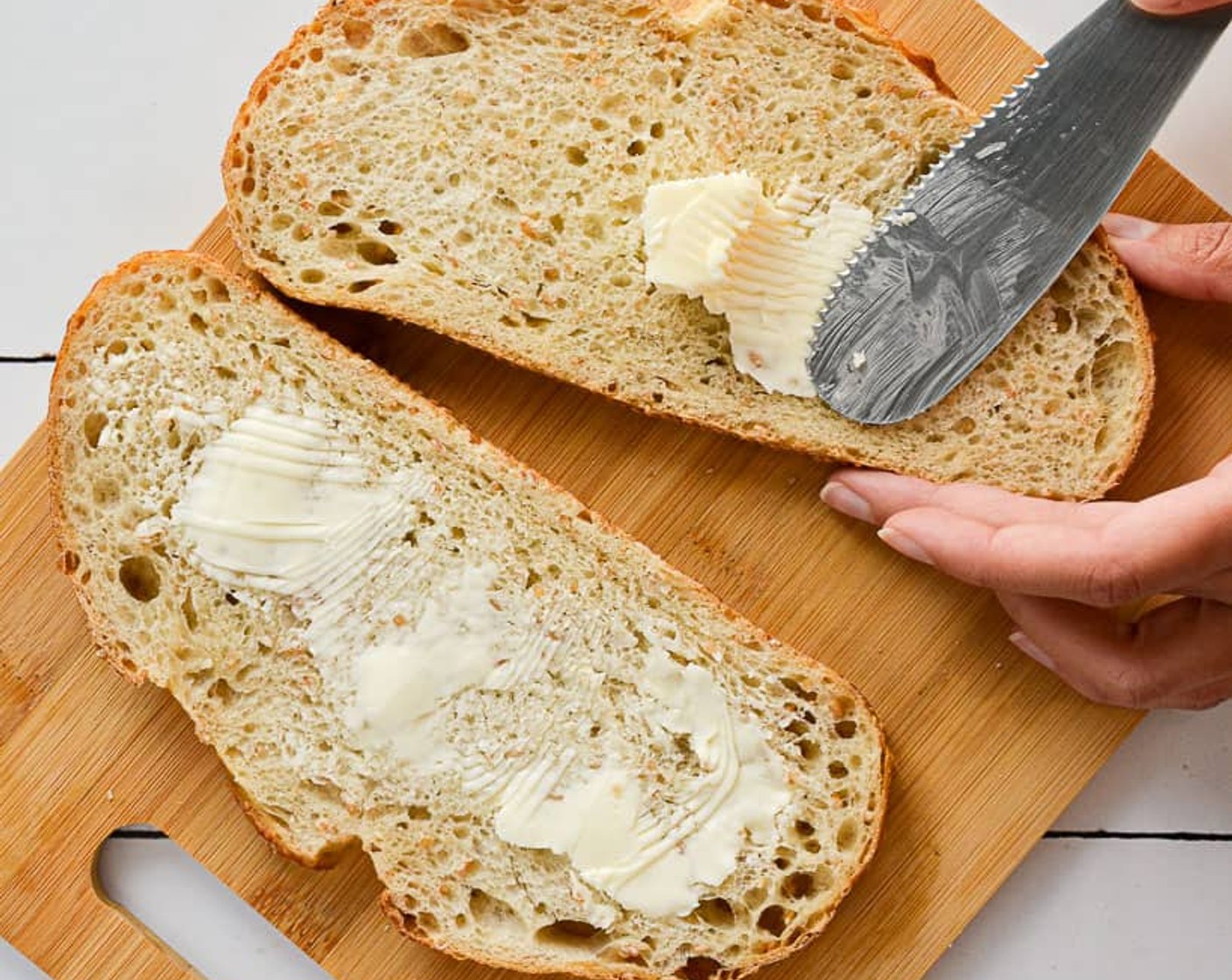 step 7 Spread the butter on one side of all slices of Sourdough Bread (8 slices), 8 sides in total.