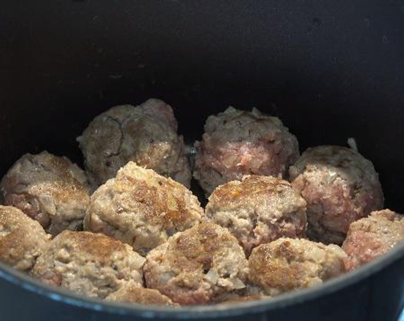 step 2 Take bits of the mixture one by one and roll them into balls. In a large oiled sauce pan over medium heat, add the meatballs and cook them for about 2 minutes.