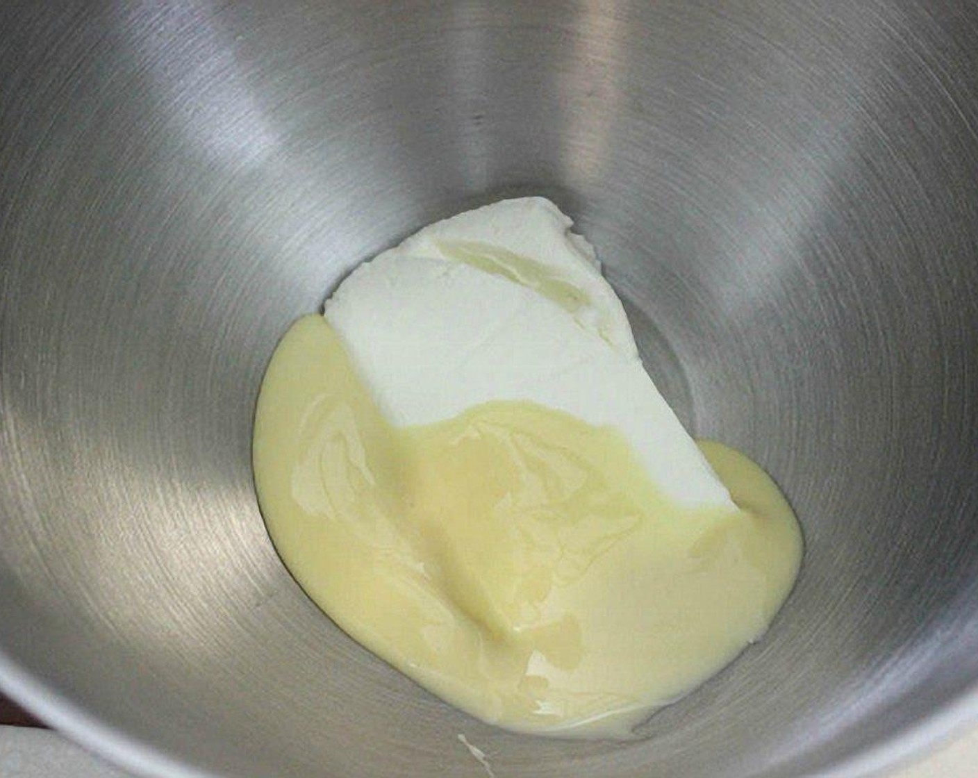 step 19 For the frosting: Add the Cream Cheese (1 cup) and Sweetened Condensed Milk (1 can) in a standing mixer with a paddle attachment.