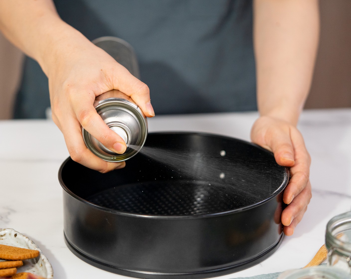 step 1 Grease the side with Nonstick Cooking Spray (as needed) and line the cake pan base with parchment paper.