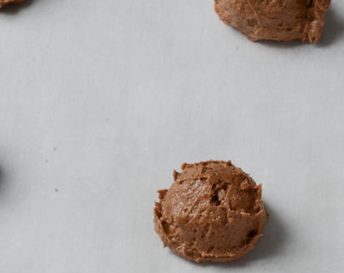 step 7 Scoop dough into rounded teaspoons and drop about 2 inches apart on the prepared cookie sheet. Bake for 10-12 minutes until done.