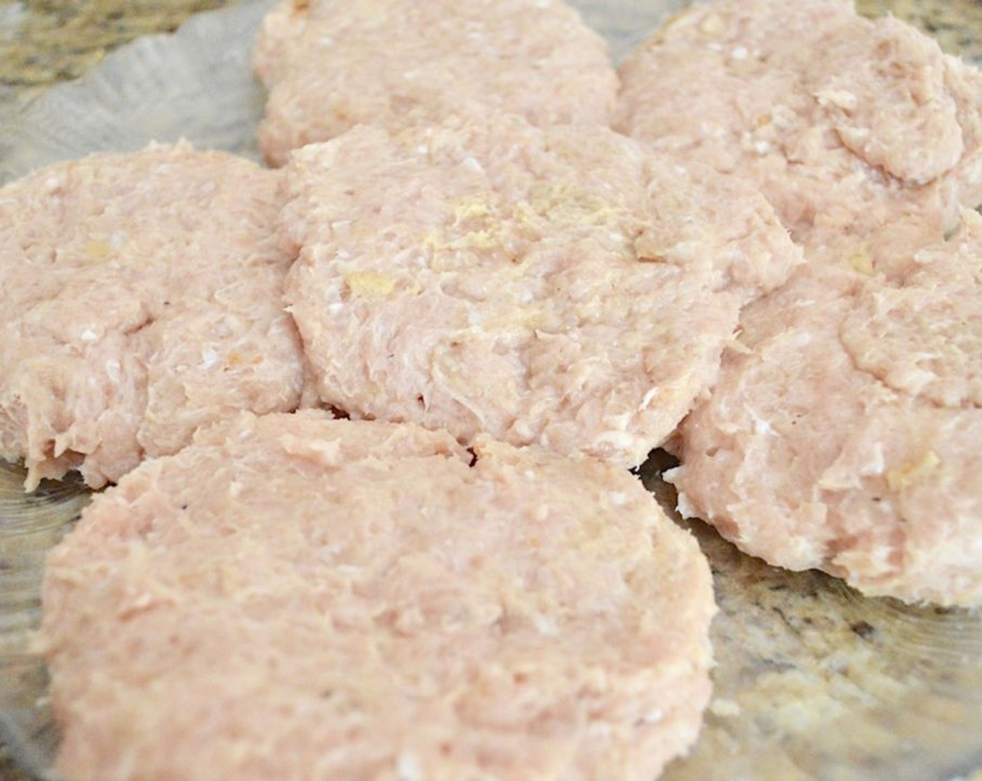 step 4 Combine the Ground Chicken (2 lb), French Onion Soup Powder Mix (1 Tbsp), Dijon Mustard (1 Tbsp), Ground Cumin (1 tsp), McCormick® Garlic Powder (1 tsp), Salt (1 pinch), and Ground Black Pepper (1 pinch) in a bowl and work it all together thoroughly with clean hands. Form the mixture you made into 6 equal patties.