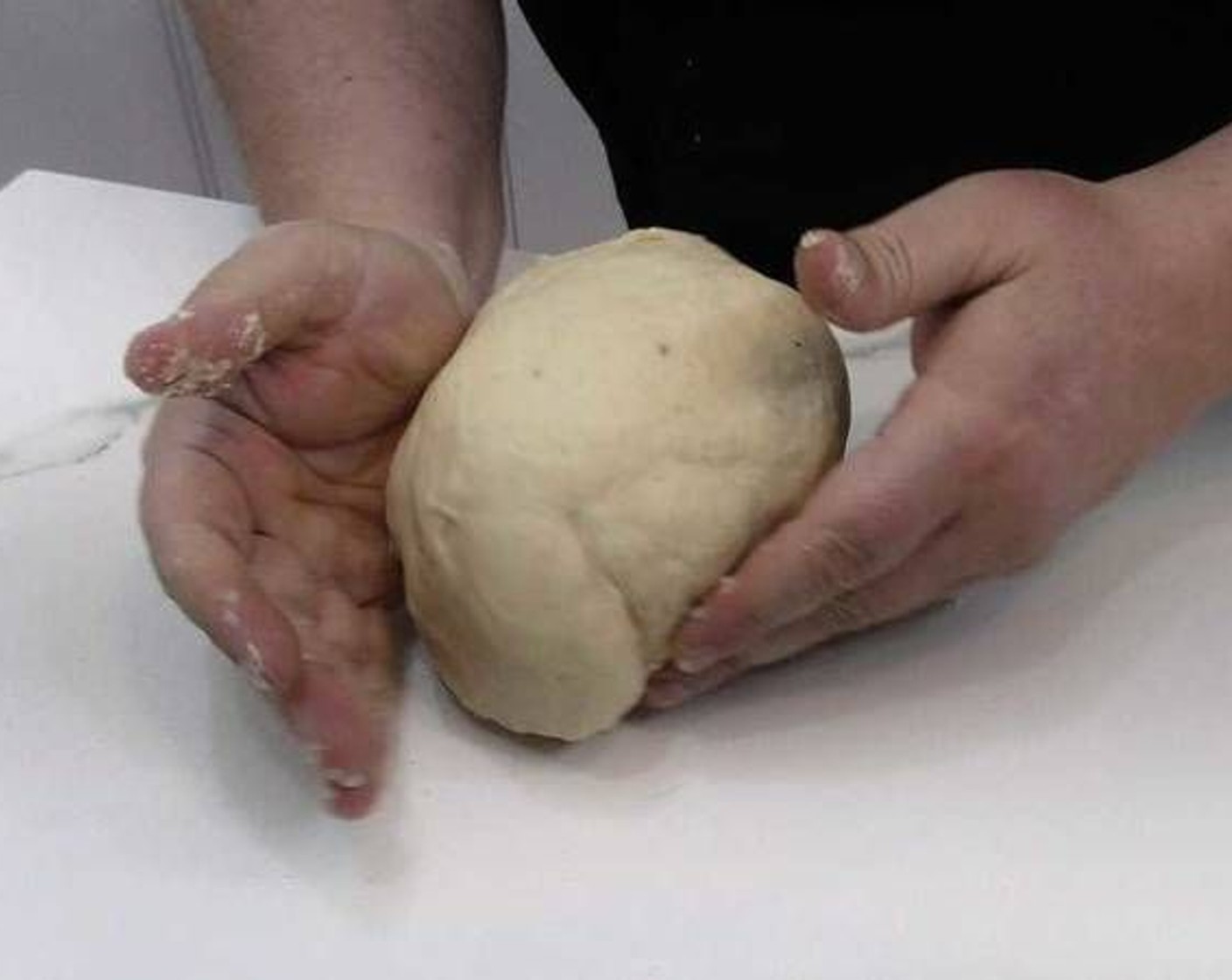 step 5 Flour a work surface and place the dough. Add flour as you knead the dough and stop adding once the dough no longer sticks to your hands.