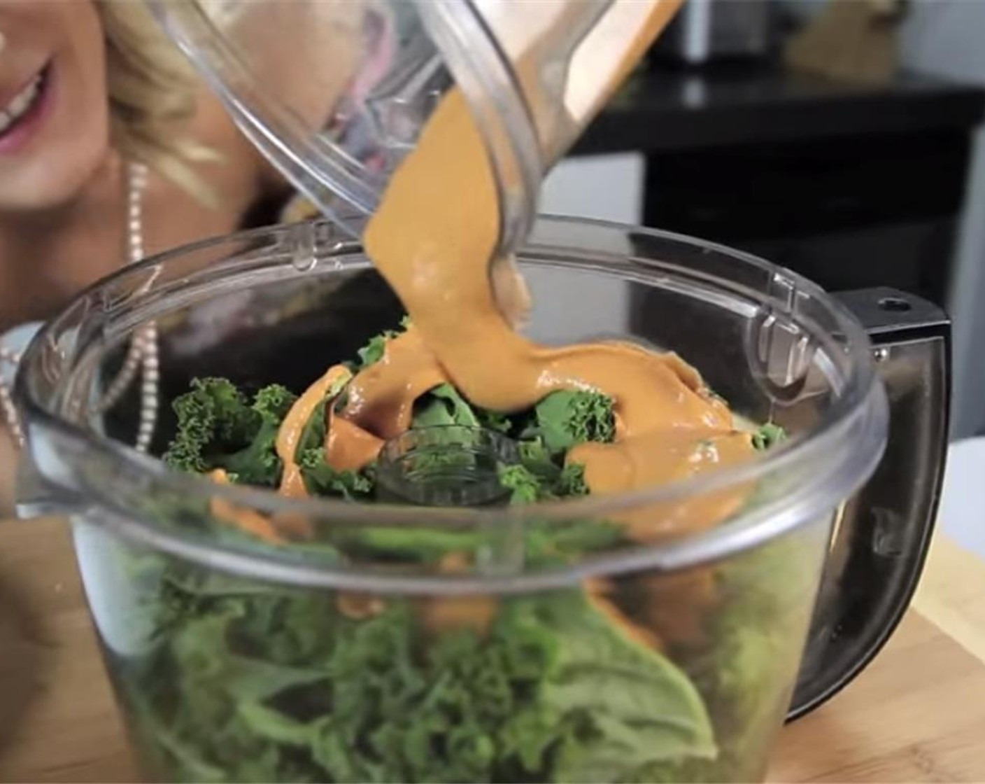 step 6 In a large container, add the kale leaves and cashew sauce. Mix until evenly combined with a fork.